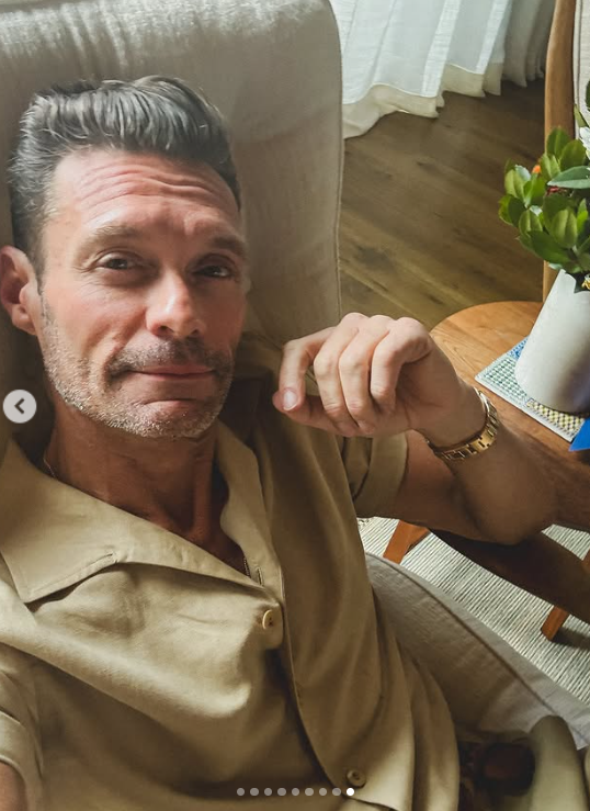 Ryan Seacrest lounges indoors in a beige shirt, offering a close-up look, posted on June 30, 2025 | Source: Instagram/ryanseacrest