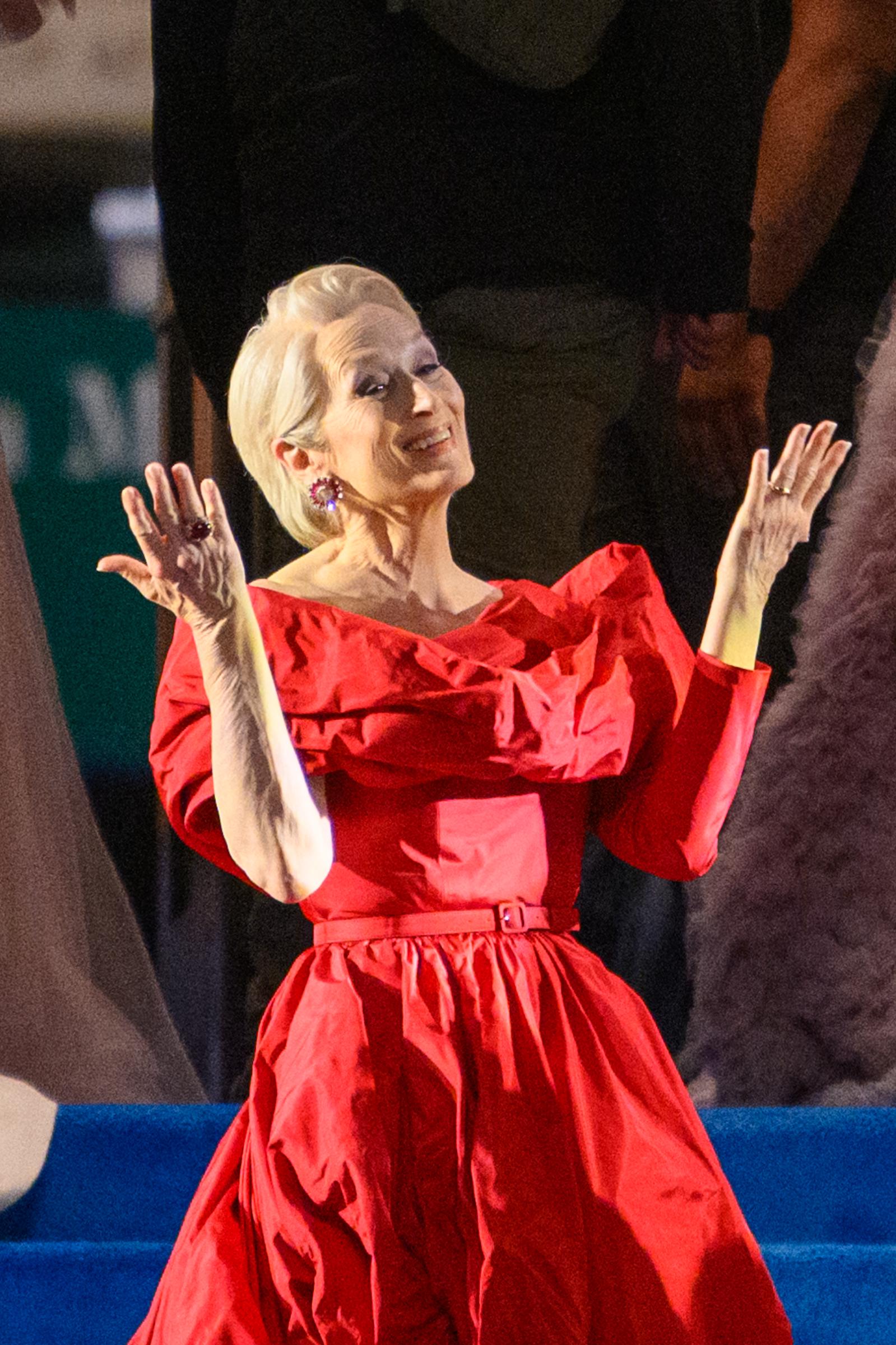 Meryl Streep waves and blows kisses to the actors and crew before wrapping for the day on 'The Devil Wears Prada 2' at the Museum of Natural History on August 1, 2025 in New York City | Source: Getty Images
