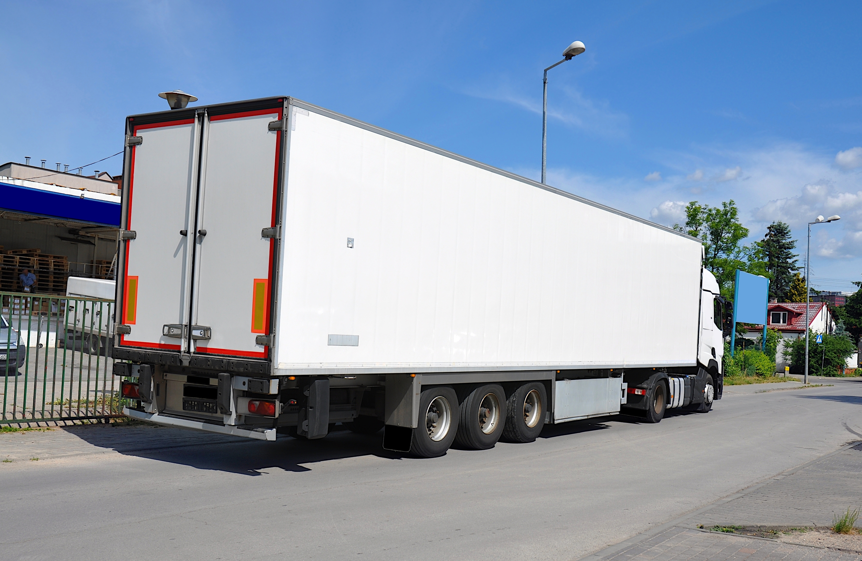 Delivery truck parked by the building. | Source: Shutterstock