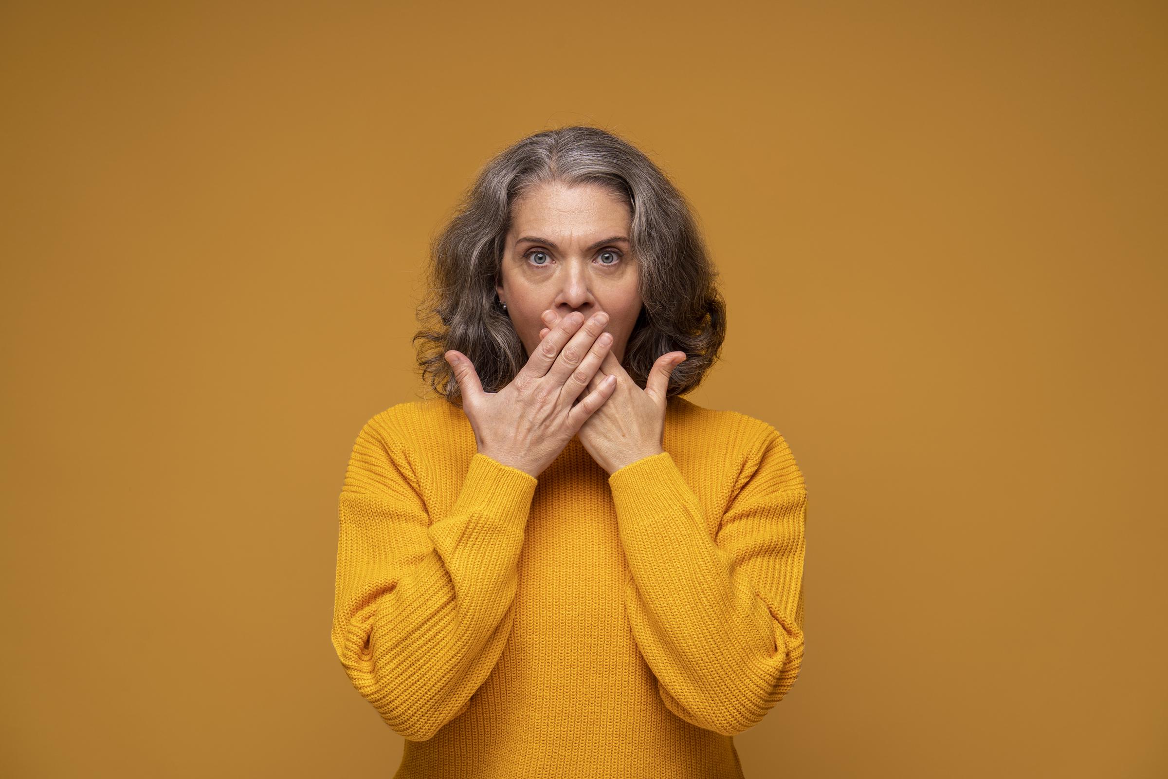 A shocked senior woman covering her mouth | Source: Pexels