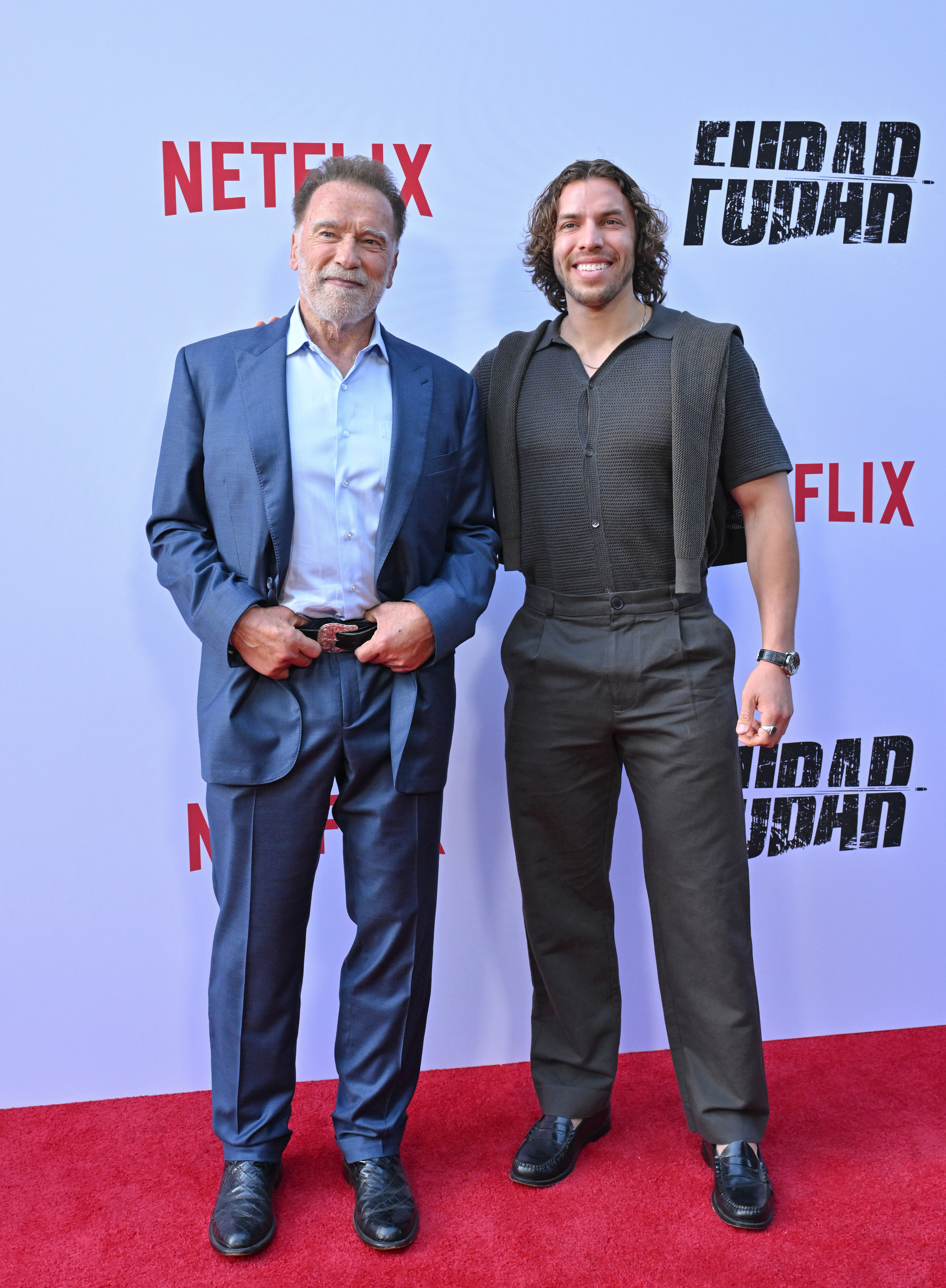Arnold Schwarzenegger and Joseph Baena attend the premiere of "Fubar" Season 2 at Netflix Tudum Theater on June 11, 2025, in Los Angeles, California | Source: Getty Images