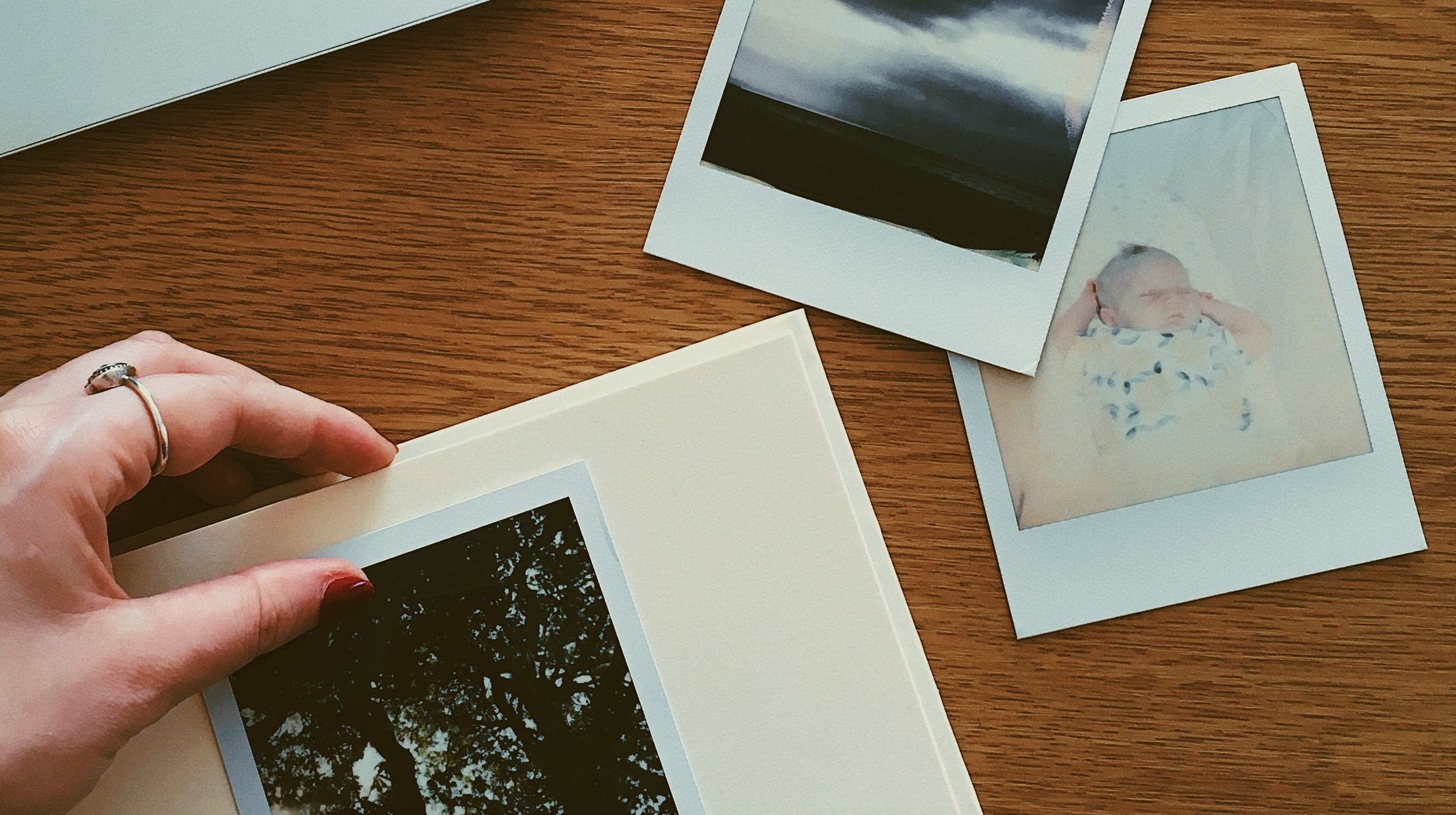 A woman looking at photos | Source: Pexels