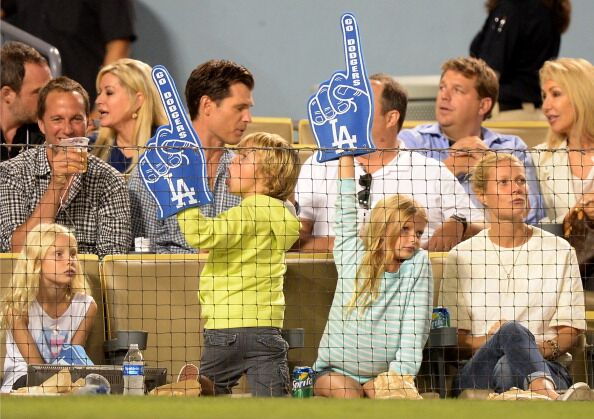 Gwyneth Paltrow (R) and Moses Martin and Apple Martin watch the game between the Arizona Diamondbacks and the Los Angeles Dodgers | Getty Images