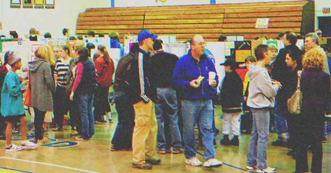 Parents at a school fair | Source: Shutterstock