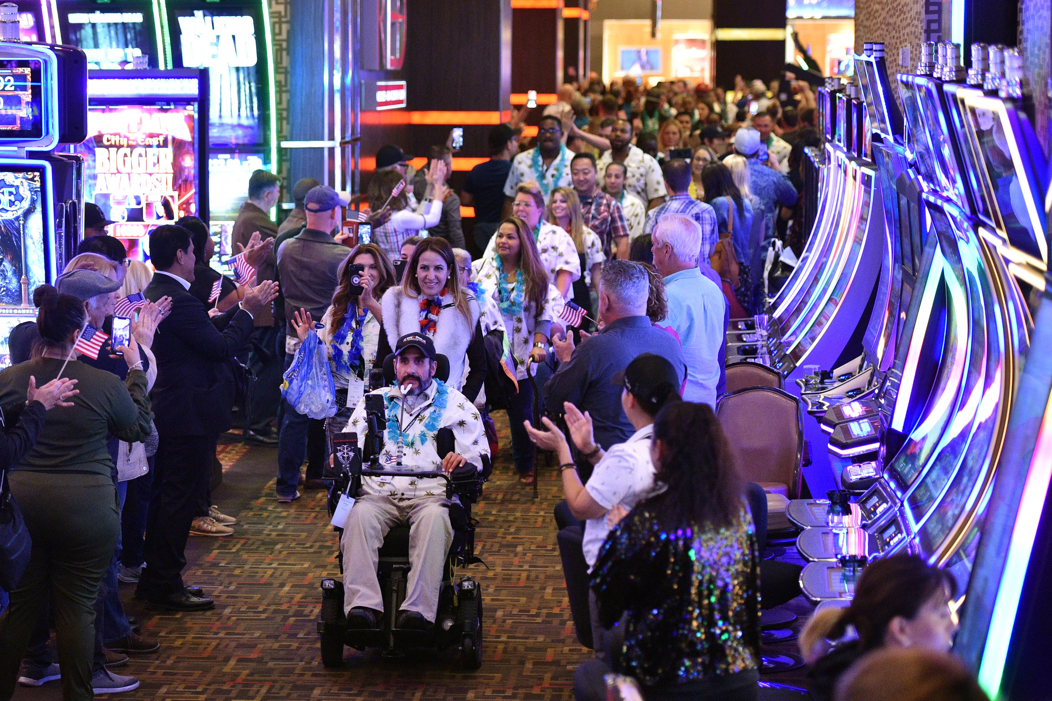 U.S. Army veteran Romy Camargo of Florida is wheeled through the “Walk of Gratitude” as part of the Salute the Troops event at the the Golden Nugget Hotel & Casino in Las Vegas, Nevada, on November 9, 2019. | Source: Getty Images