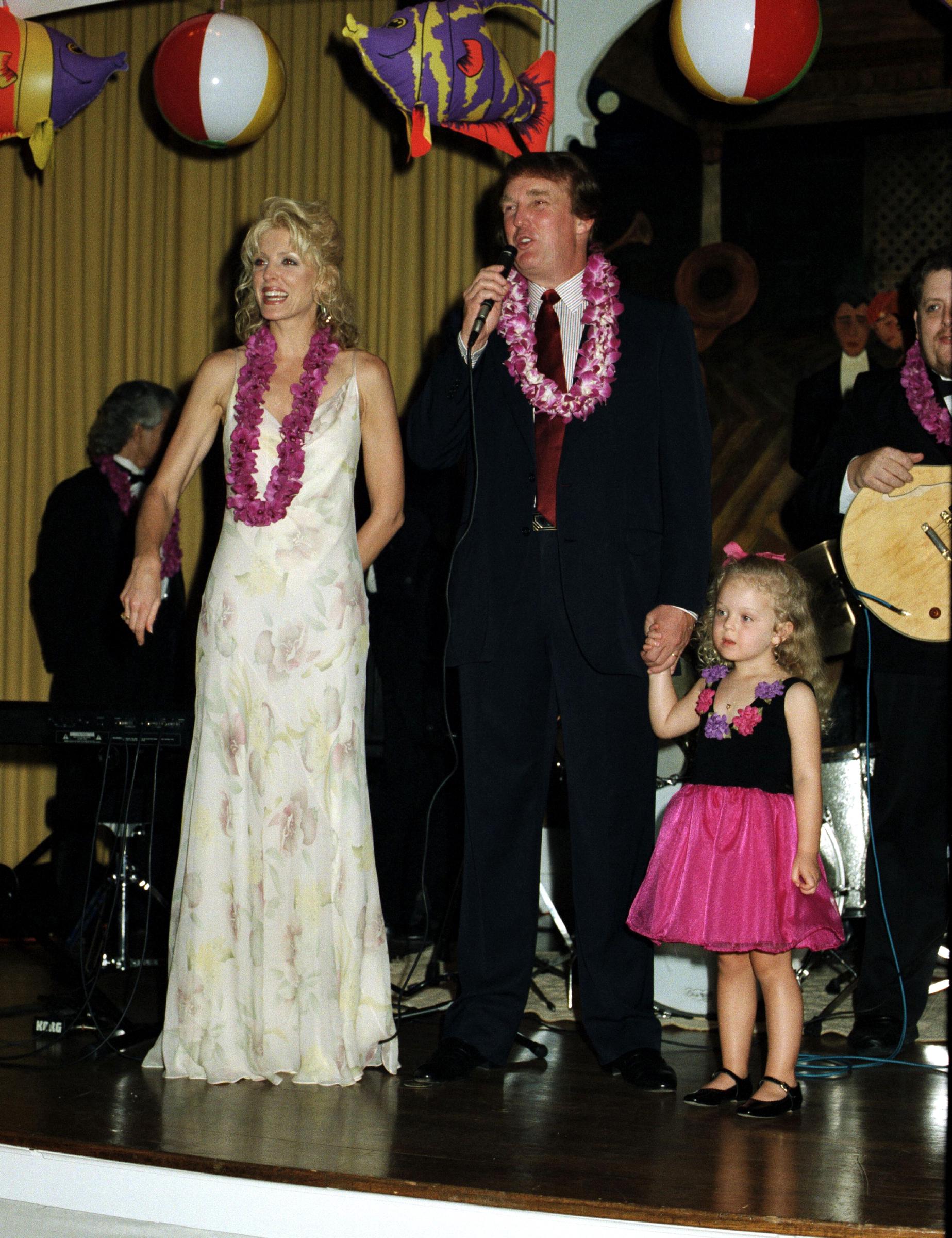 Marla Maples and Donald Trump with their daughter on stage at the Mar-a-Lago estate in Palm Beach, Florida, on March 1, 1997. | Source: Getty Images