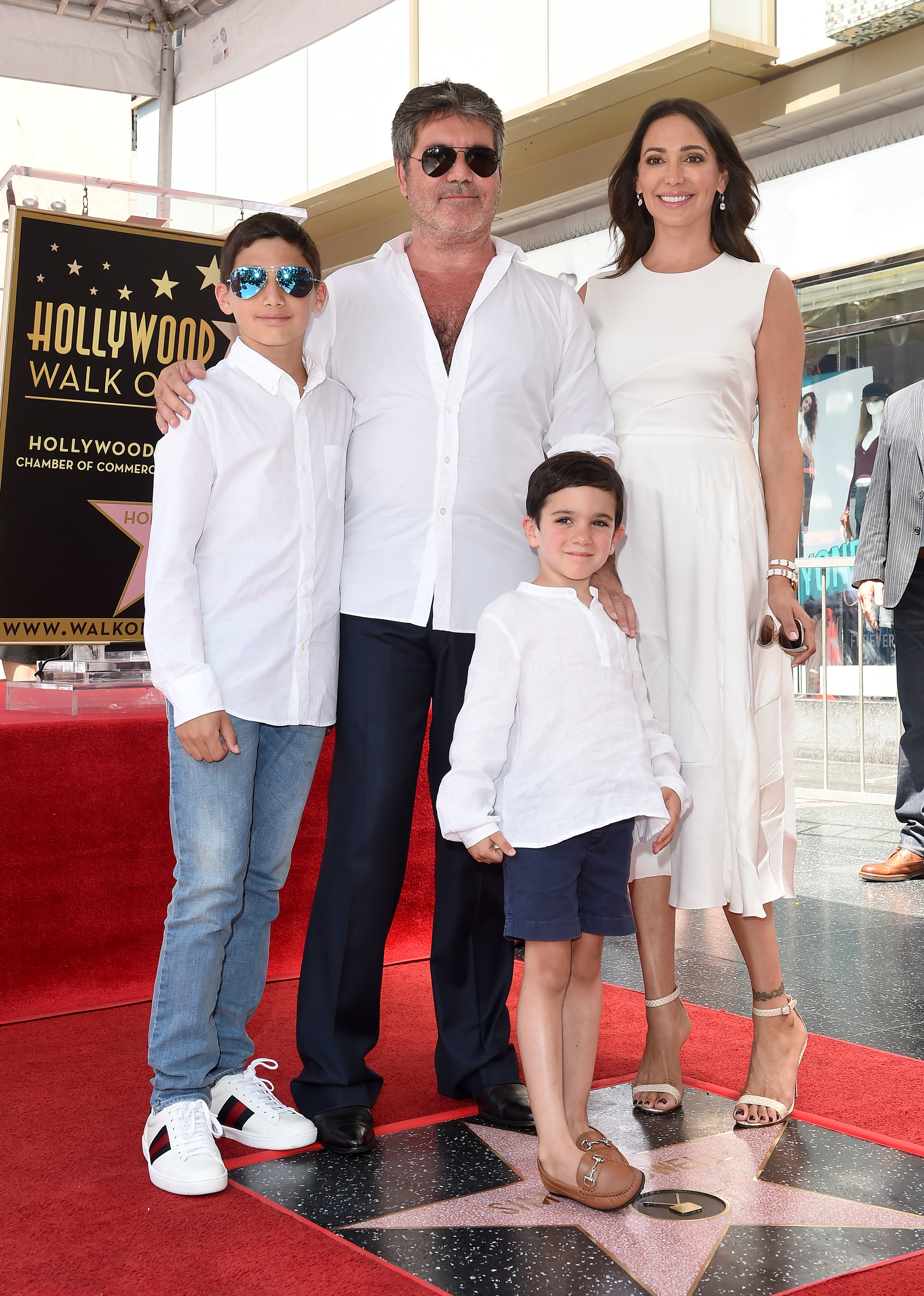 Simon Cowell, Lauren Silverman, Eric Cowell and Adam Silverman at the Hollywood Walk of Fame on August 22, 2018 in Hollywood, California | Source: Getty Images