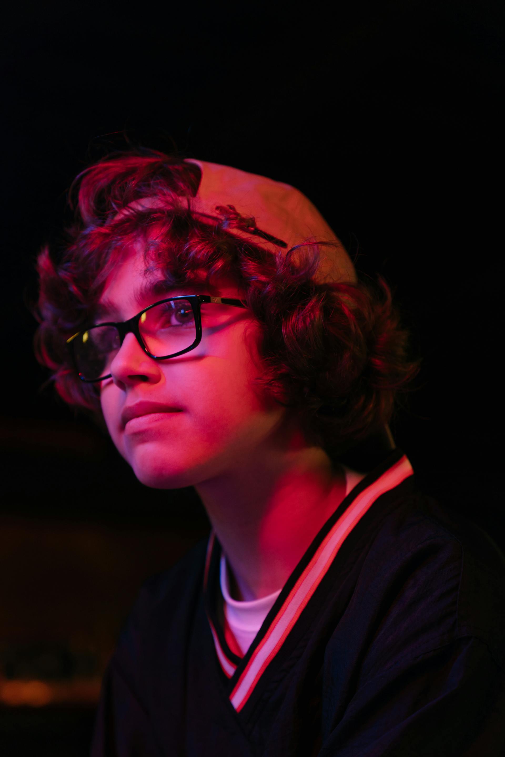 Boy with a backwards baseball cap | Source: Pexels