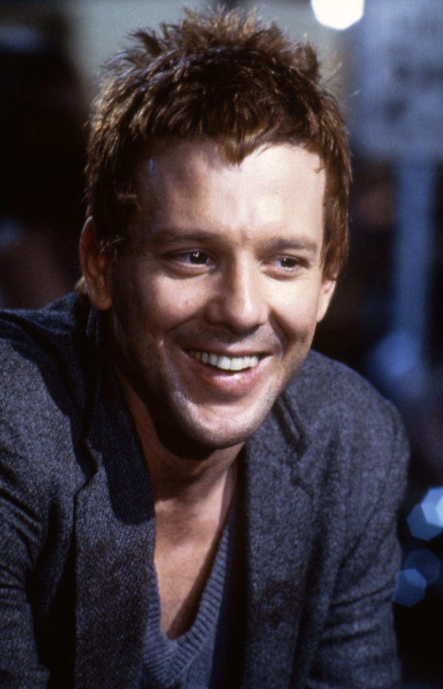 On the set of "Rumble Fish" in 1983, Mickey Rourke flashed a wide smile while sporting short, tousled hair and a relaxed layered look. The Francis Ford Coppola film arrived during Rourke's ascent in Hollywood, capturing the actor several years before roles in "9 1/2 Weeks" and "Angel Heart" cemented his reputation as an '80s heartthrob.