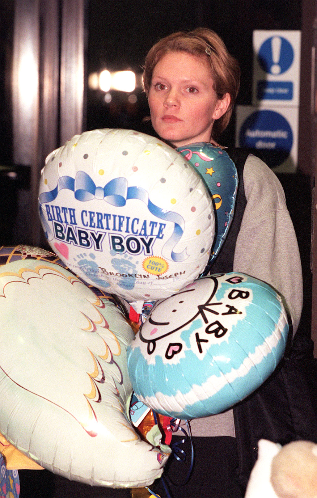 Louise Adams visiting her sister Victoria Beckham with her then-fiancé David Beckham, as the couple prepared to leave London's Portland Hospital with their newborn son, Brooklyn Joseph Beckham, on March 9, 1999 | Source: Getty Images