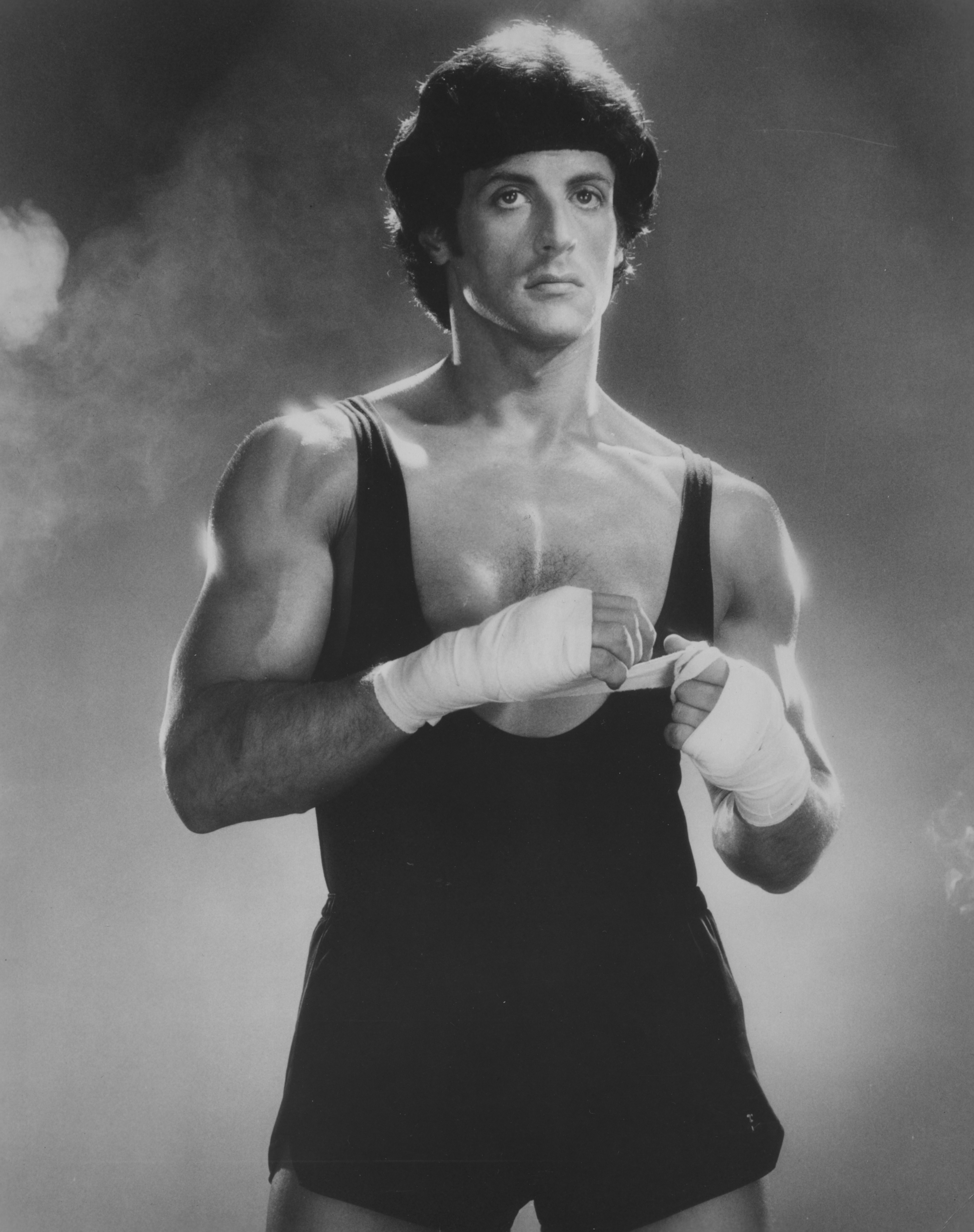 Sylvester Stallone in a vest and shorts while posing for a boxing shot circa 1970 | Source: Getty Images