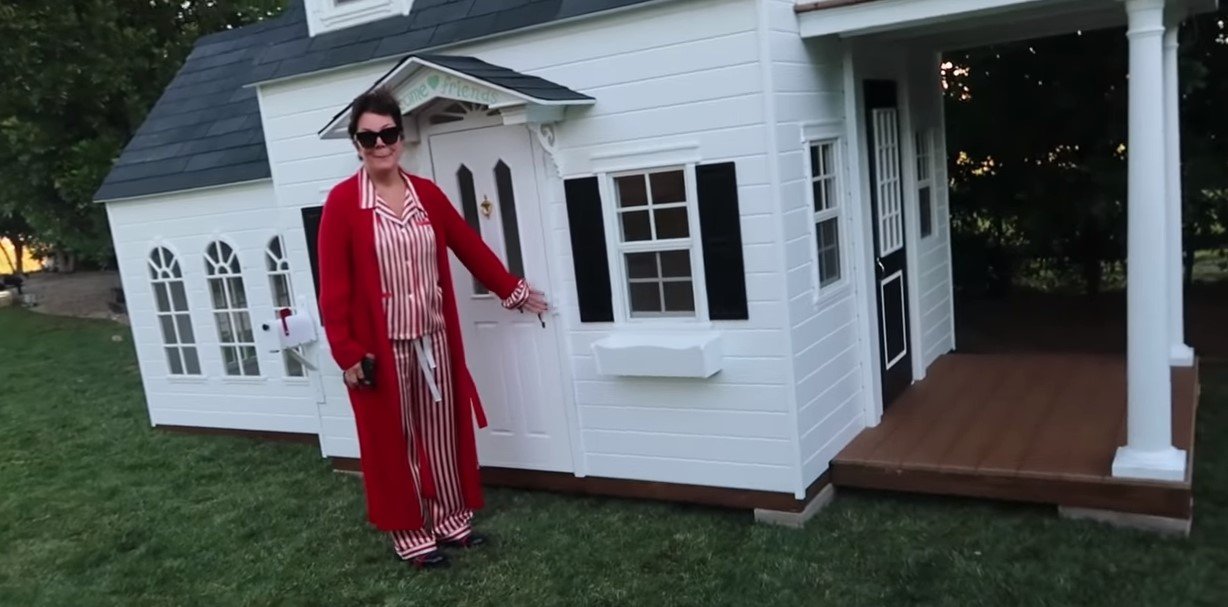 Kris Jenner in front of the giant playhouse she got for Stormi as a Christmas gift | Photo: Youtube/ Kylie Jenner