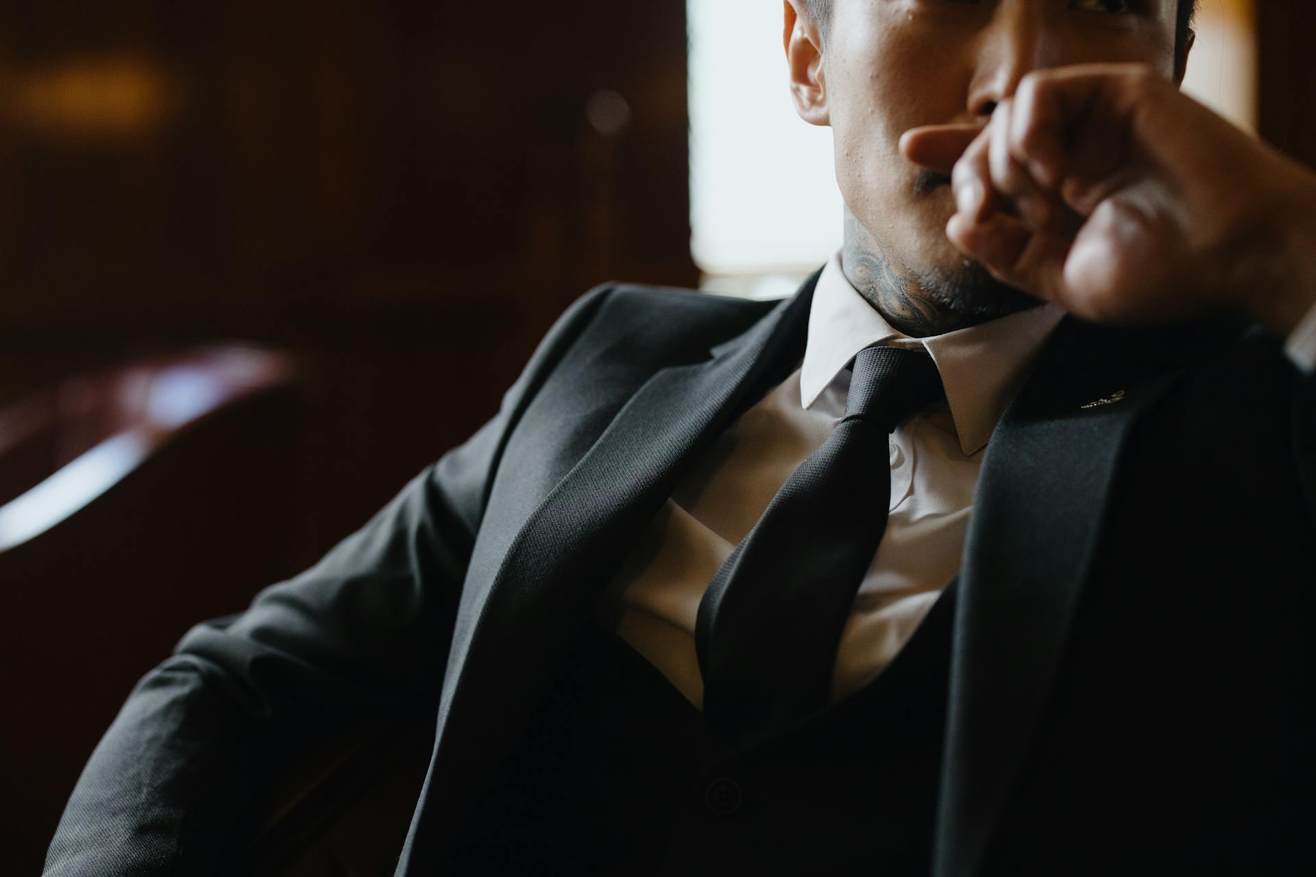 Close-up shot of a man in a black suit | Source: Pexels