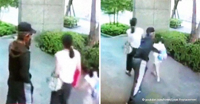 Shocking moment a man tries to snatch a child from her mother in the middle of the street
