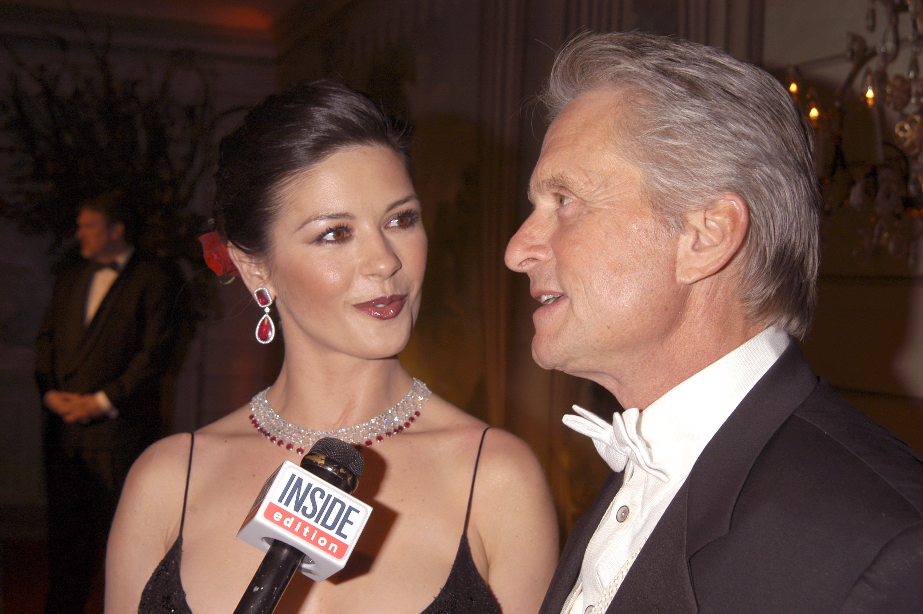 Actress Catherine Zeta-Jones and her husband actor Michael Douglas during The Eighth Red Ball at Pierre Hotel on February 7, 2005 in New York ┃Source: Getty Images