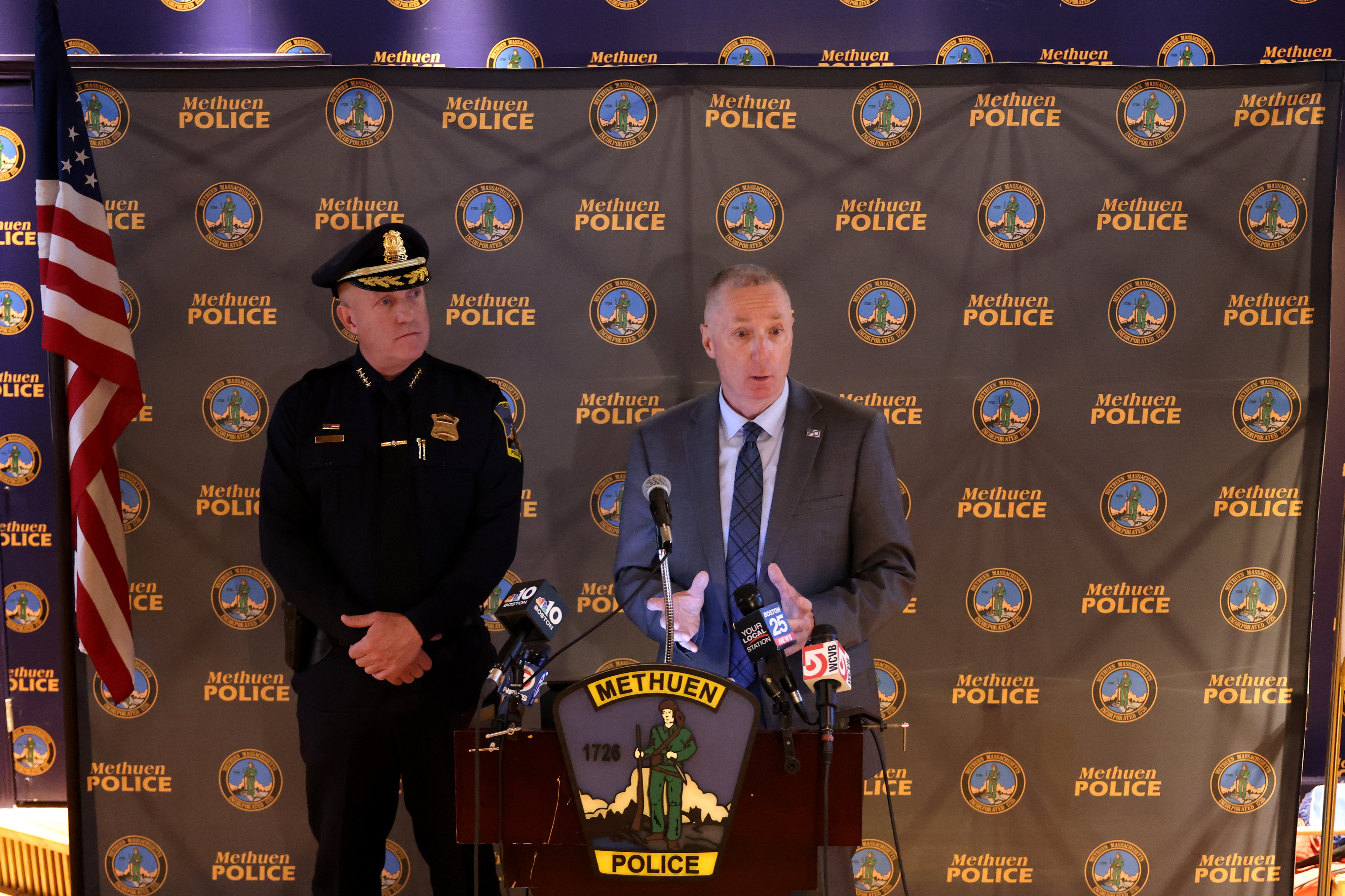 Essex County District Attorney (DA) Paul Tucker speaking alongside a police officer at a press conference in Methuen, Massachusetts on June 16, 2024. | Source: Getty Images