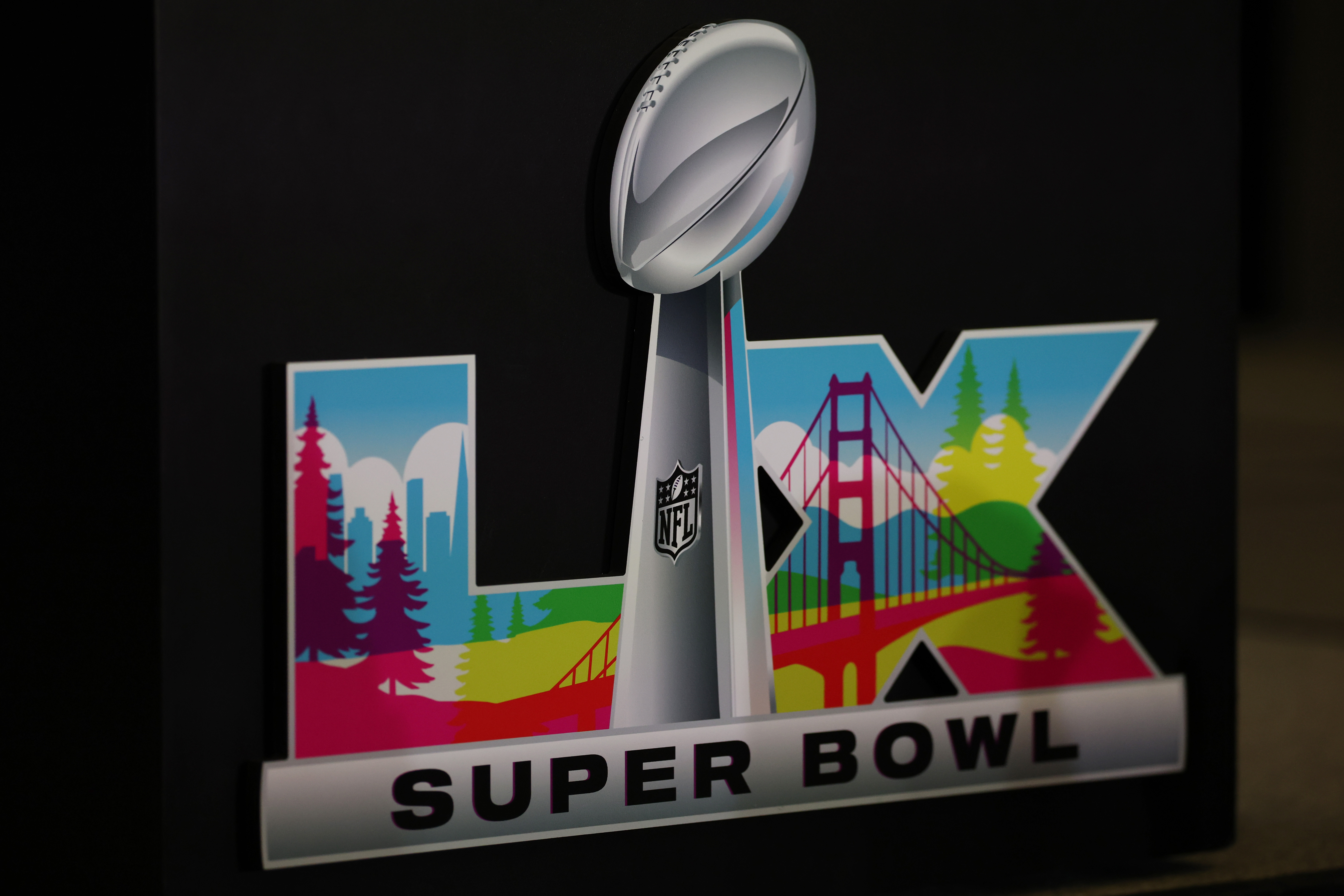 A detailed view of the Super Bowl LX logo during Opening Night at San Jose McEnery Convention Center in California on February 2, 2026. | Source: Getty Images