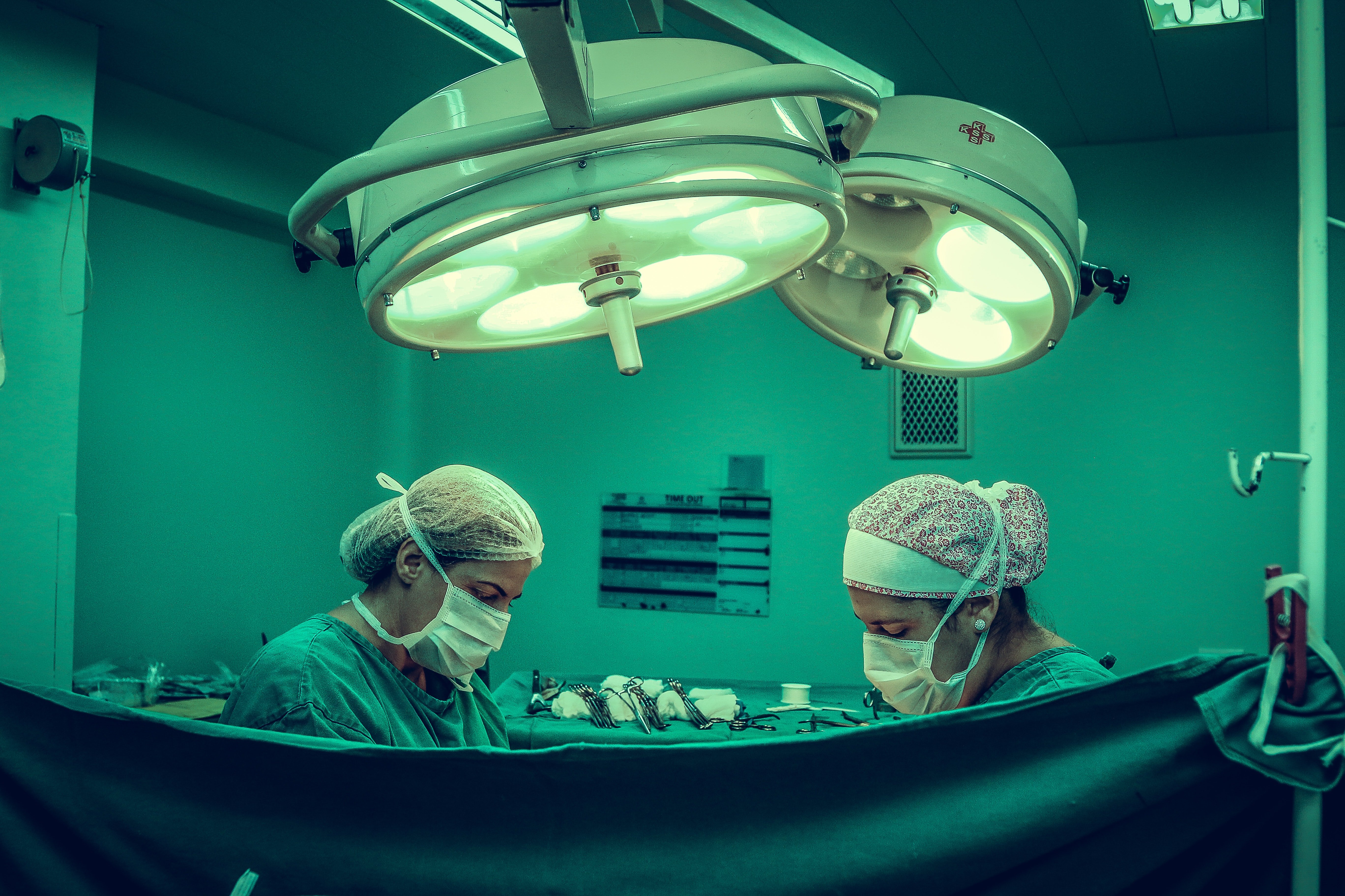 Pictured - Two surgeons performing surgery in theatre | Source: Pexels 