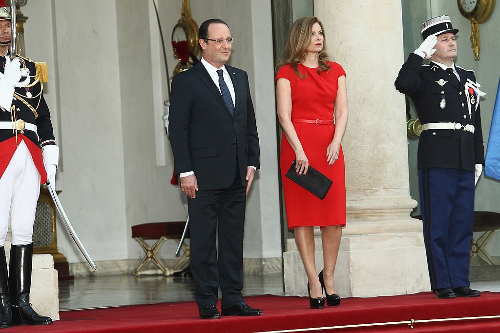     French President Francois Hollande and Valerie Trierweiler pose as they arrive for a state dinner at the Elysee Palace, May 7, 2013 in Paris, France.  |  Photo: Getty Images