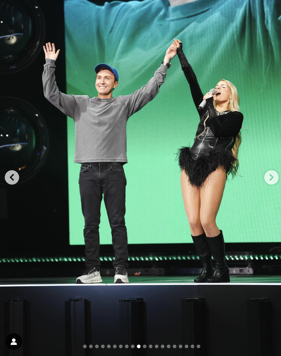 Daryl Sabara and Meghan Trainor are seen onstage in a photo, dated October 21, 2024 | Source: Instagram/meghantrainor