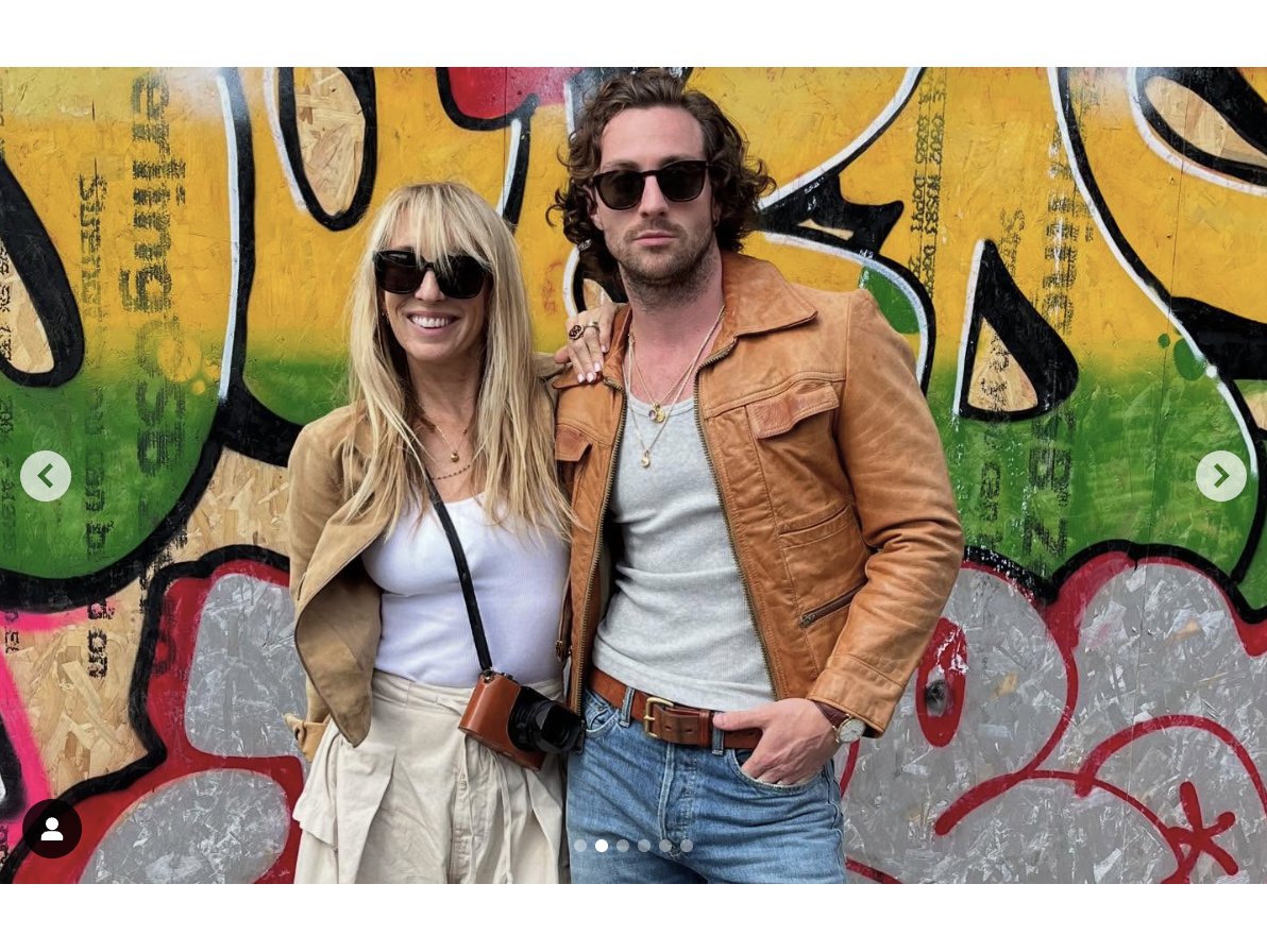 Sam Taylor-Johnson and Aaron Taylor-Johnson pose in front of a graffiti-covered wall, as seen in a photo shared on March 4, 2025 | Source: Instagram/aarontaylorjohnson