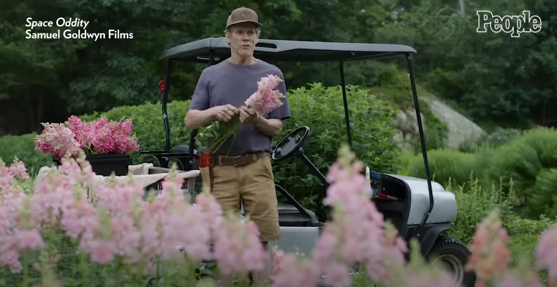 Kevin Bacon holding flowers | Source: YouTube/@People