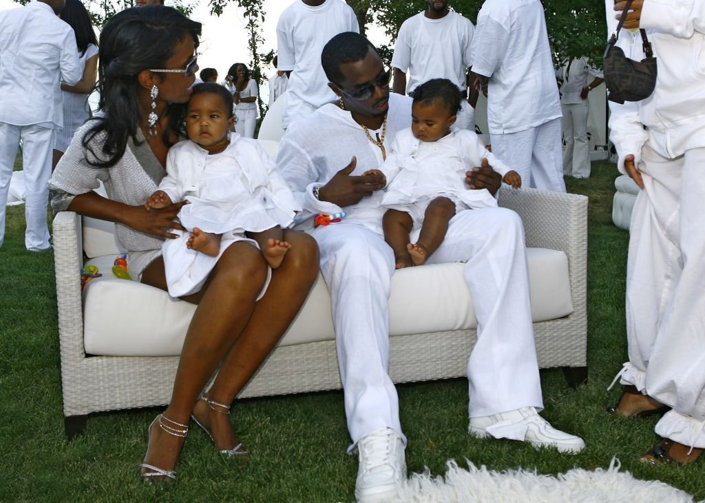 Host Sean "Diddy" Combs and Kim Porter with their twin daughters D'Lila Star Combs and Jessie James Combs pictured at "The Real White Party" presented by Sean "Diddy" Combs at the Combs' East Hampton estate | Photo: Getty Images
