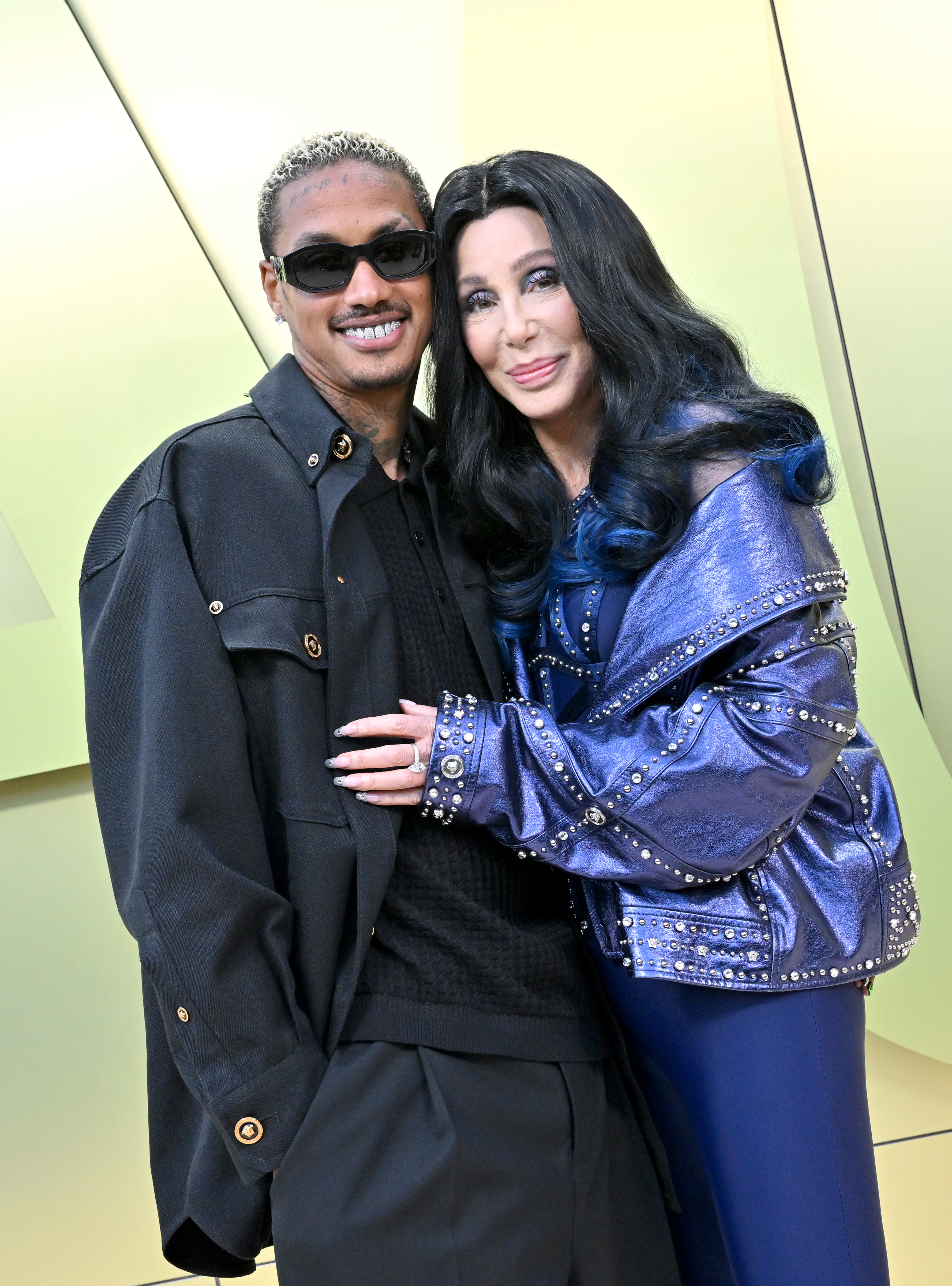 Alexander "AE" Edwards and Cher attend the Versace FW23 Show at Pacific Design Center on March 9, 2023, in West Hollywood, California. | Source: Getty Images