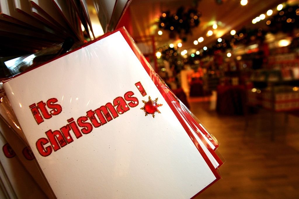 Christmas cards are displayed with Christmas themed merchandise at Harrods in Knightsbridge for the launch of the store's 'Christmas World' on August 7, 2007 | Photo: Getty Images