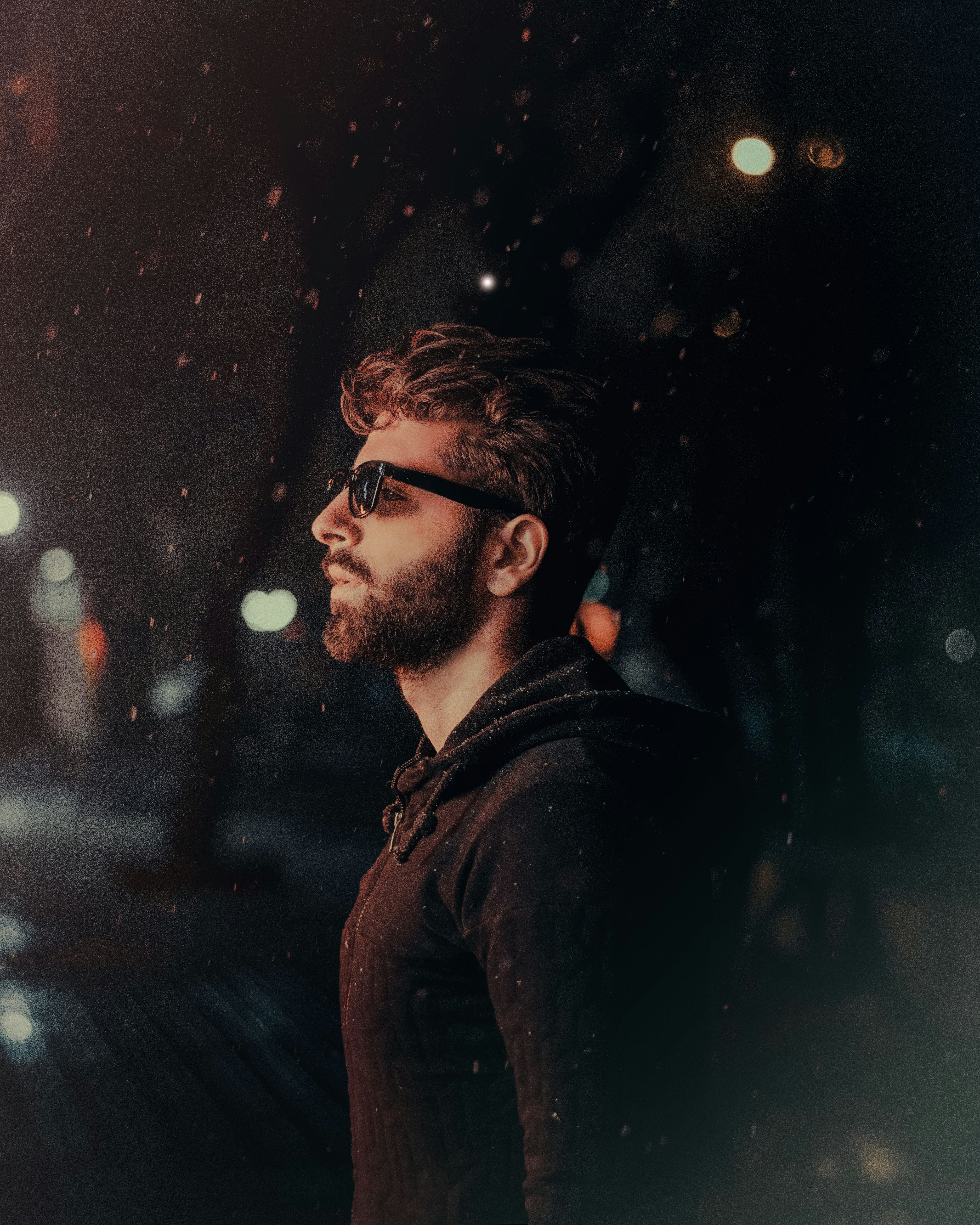 A serious man outside at night | Source: Unsplash