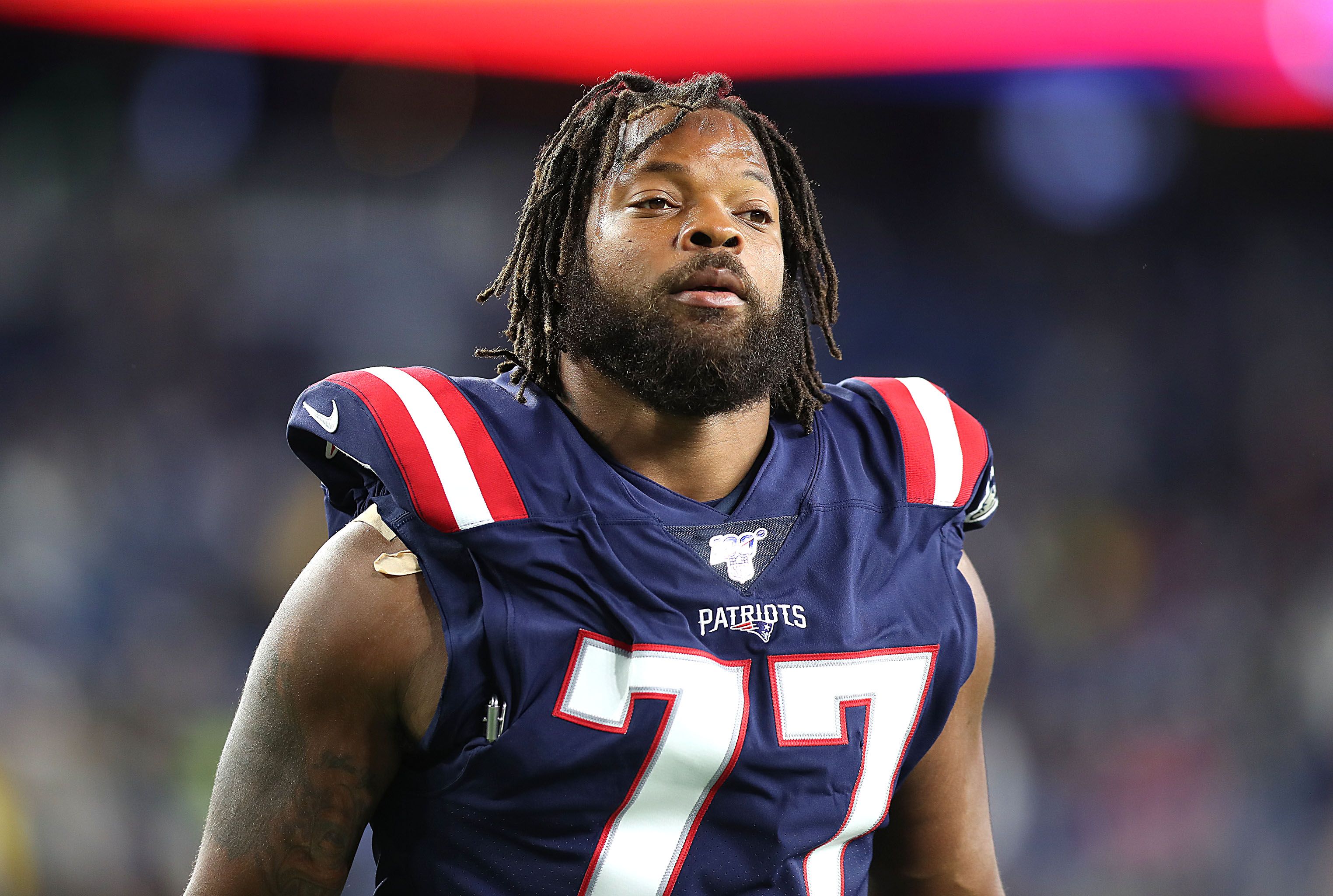 NFL player Michael Bennett at Gillette Stadium in Foxborough, MA in 2019 | Source: Getty Images