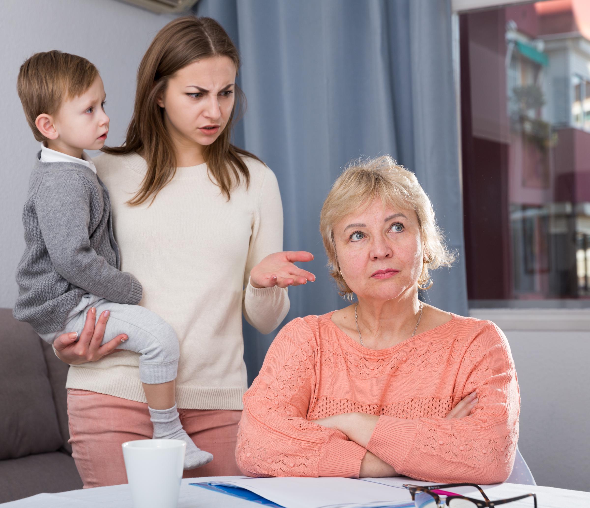 Woman with a child arguing with a stubborn older lady | Source: Shutterstock