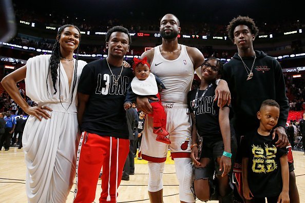 Dwyane Wade, Gabrielle Union, Dahveon Morris, and children, Kaavia James Union Wade, Zaire Wade, Xavier Wade and Zion Wade at American Airlines Arena on April 09, 2019 | Photo: Getty Images