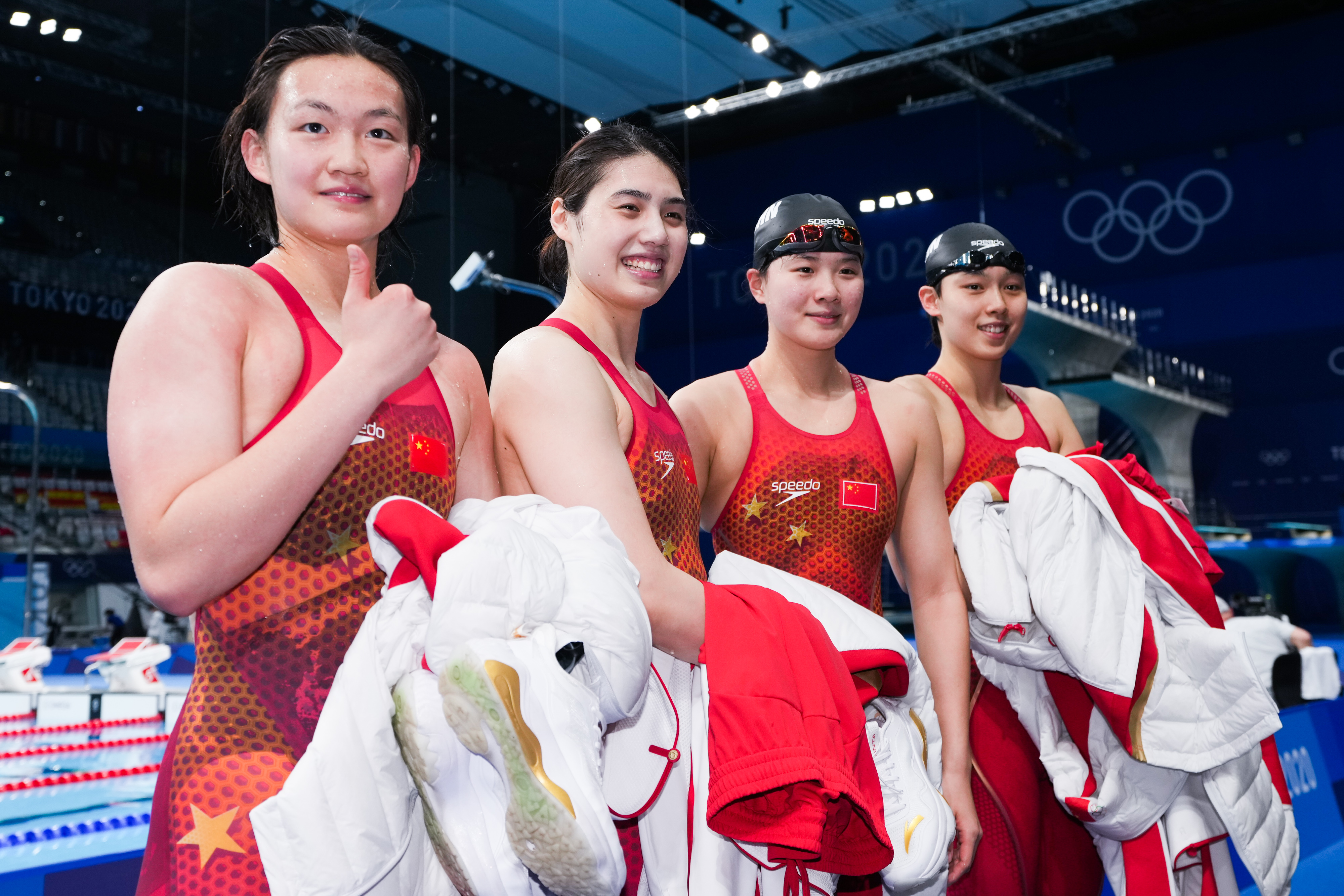 Yang Junxuan, Tang Muhan, Zhang Yufei, and Li Bingjie celebrating during the medal ceremony for the Women's 4x200-meter Freestyle Relay Final on day six of the Tokyo 2020 Olympic Games on July 29, 2021, in Tokyo, Japan. | Source: Getty Images