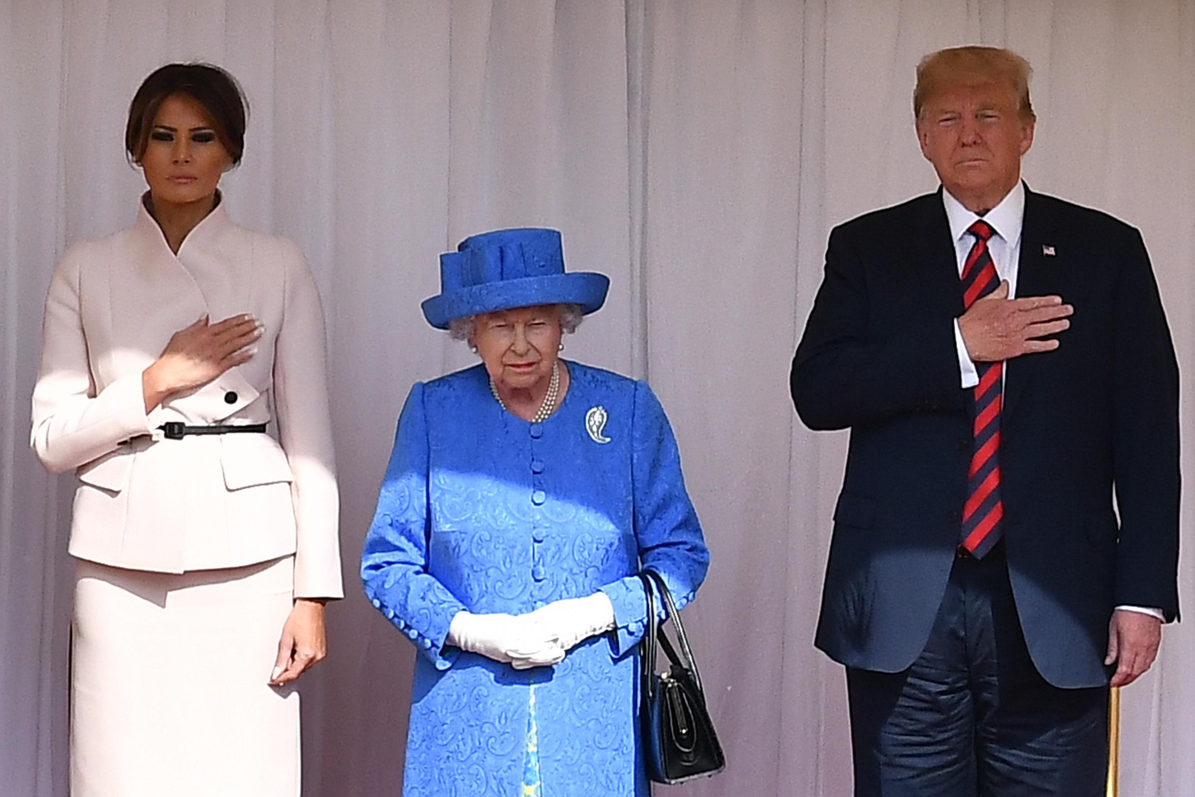 Queen Elizabeth II stands with US President Donald Trump and First Lady Melania Trump on the dias in the Quadrangle at Windsor Castle on July 13, 2018 in Windsor, England | Source: Getty Images