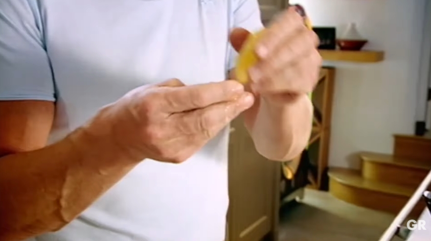 Gordon Ramsay demonstrates a quick remedy for the lingering burn left behind after handling fresh chilies. By rubbing fresh lemon juice onto his fingers, he shows how a simple kitchen staple can help remove the heat before moving on to the next ingredient. | Source: YouTube/ Gordon Ramsay