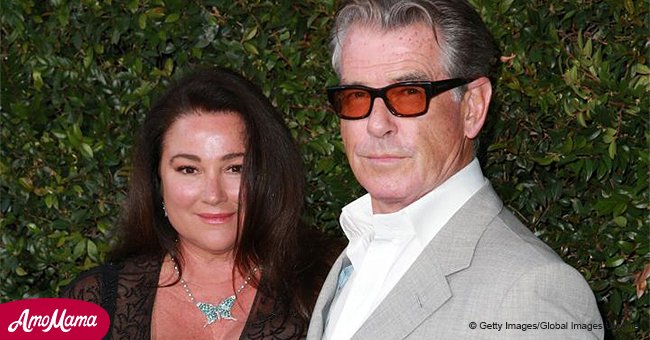 Pierce Brosnan's wife drew attention with her ample cleavage in a sheer black dress