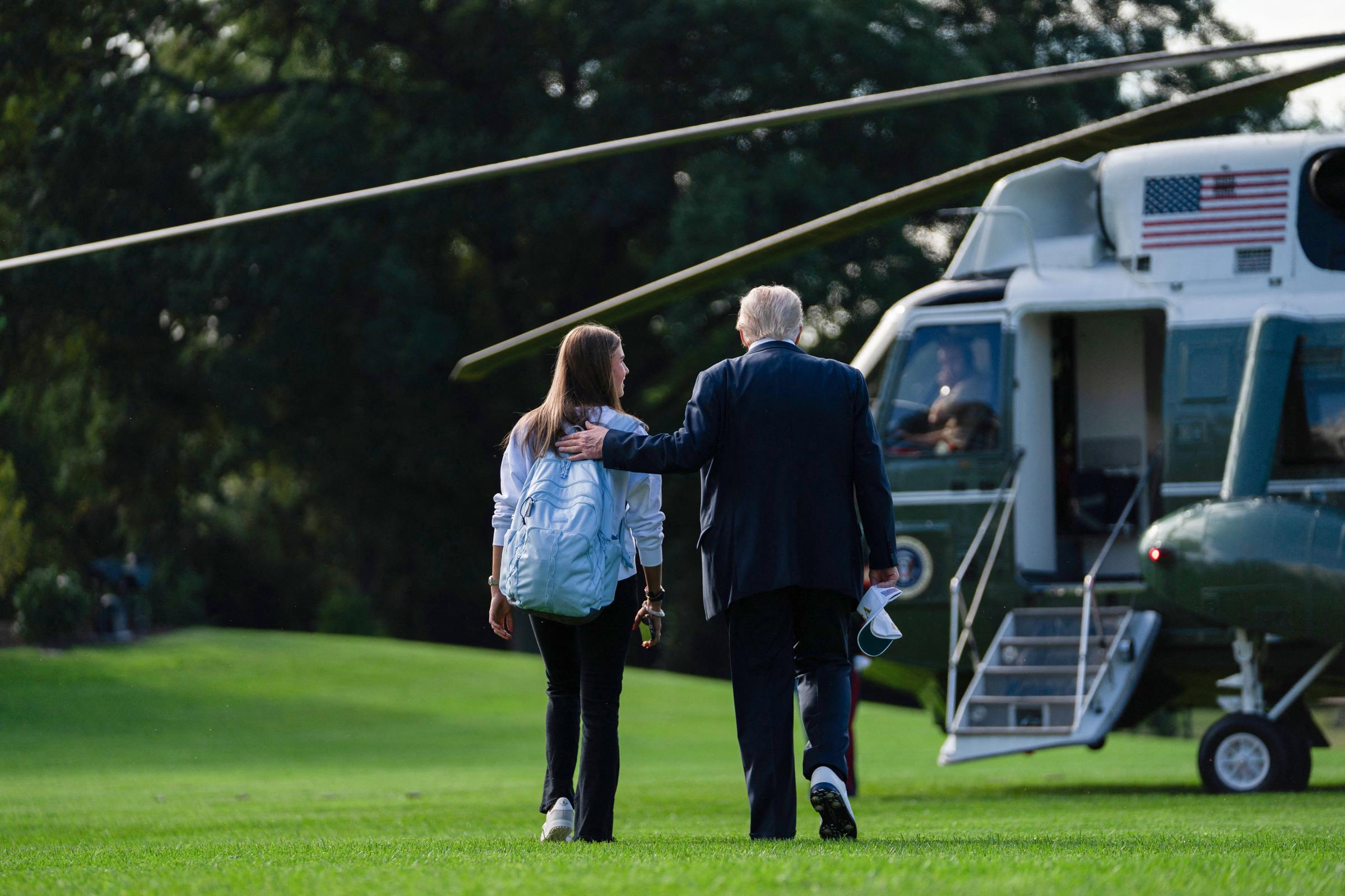 Donald Trump walks to board Marine One with his granddaughter Kai Trump on the South Lawn of the White House in Washington, DC, on September 26, 2025 | Source: Getty Images