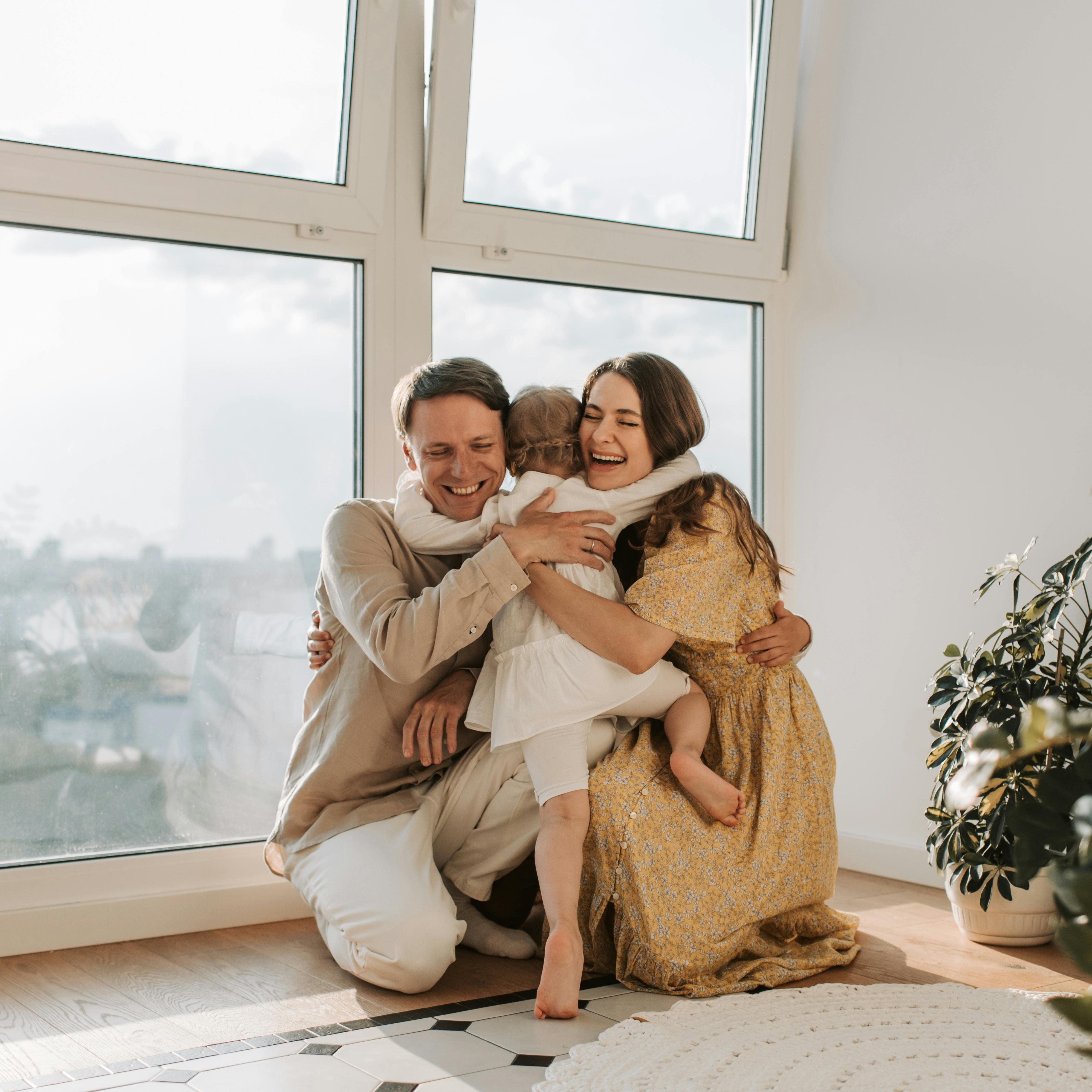 A happy family and their daughter | Source: Pexels