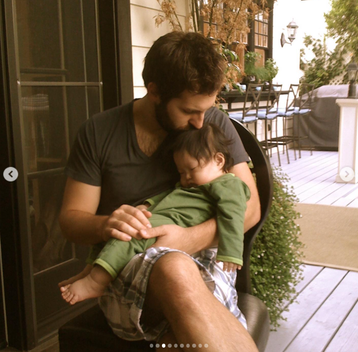 Josh Kelley holds Naleigh as she sleeps during a quiet family moment | Source: Instagram/katherineheigl