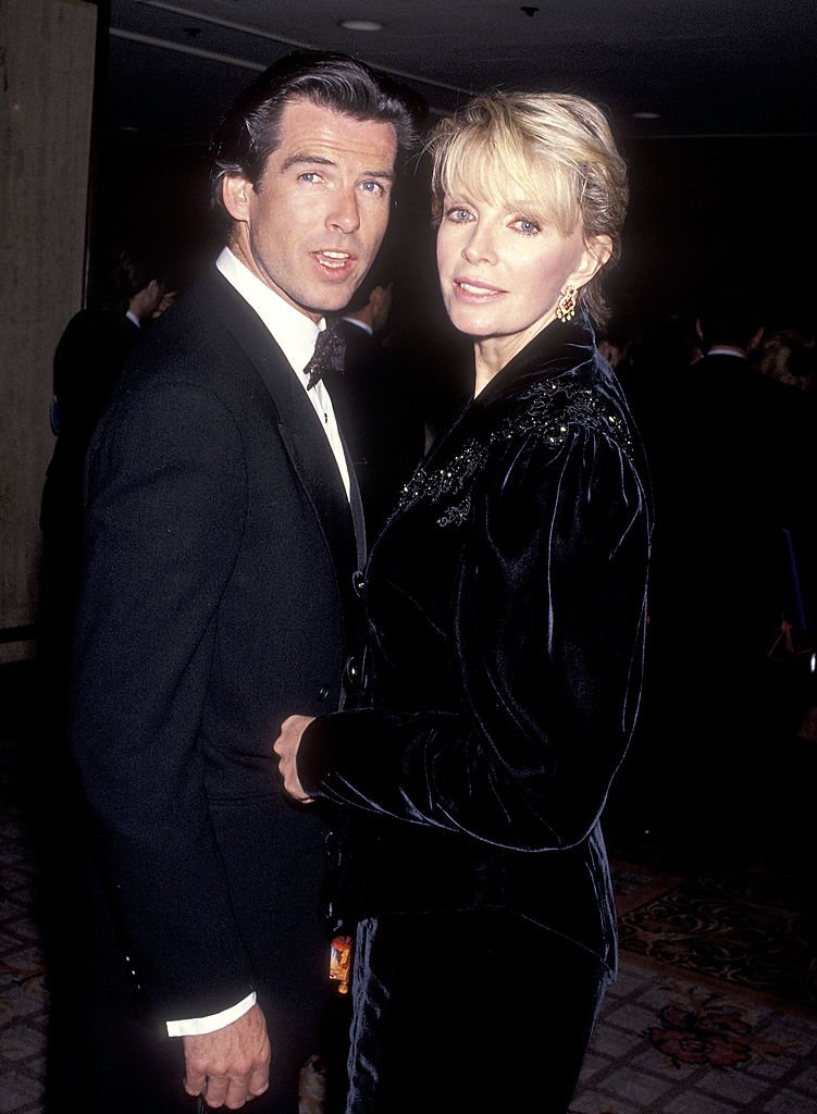 Pierce Brosnan and Cassandra Harris attend the California Fashion Industry Friends of AIDS Project Los Angeles Fifth Annual Fashion Show & Dinner Benefit Salute to Gianni Versace in February 1991. | Source: Getty Images