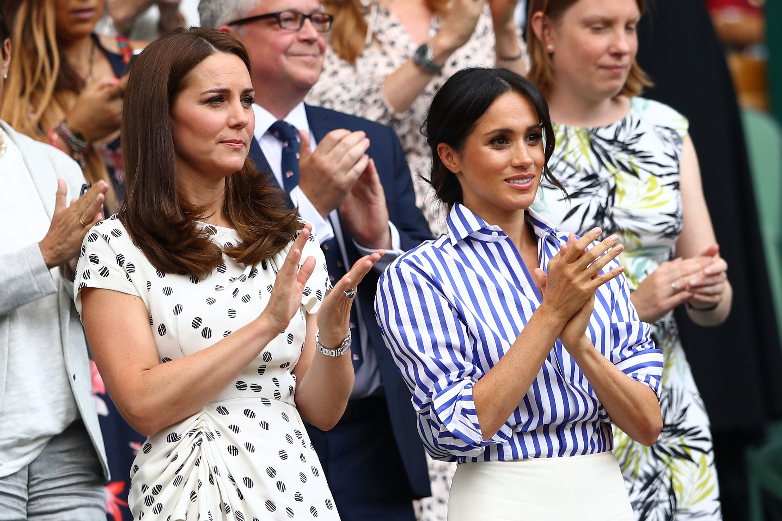 Kate Middleton and Meghan Markle applaud ahead of the Ladies' Singles final match on day twelve of the Wimbledon Lawn Tennis Championships at All England Lawn Tennis and Croquet Club on July 14, 2018 in London, England | Photo: Getty Images