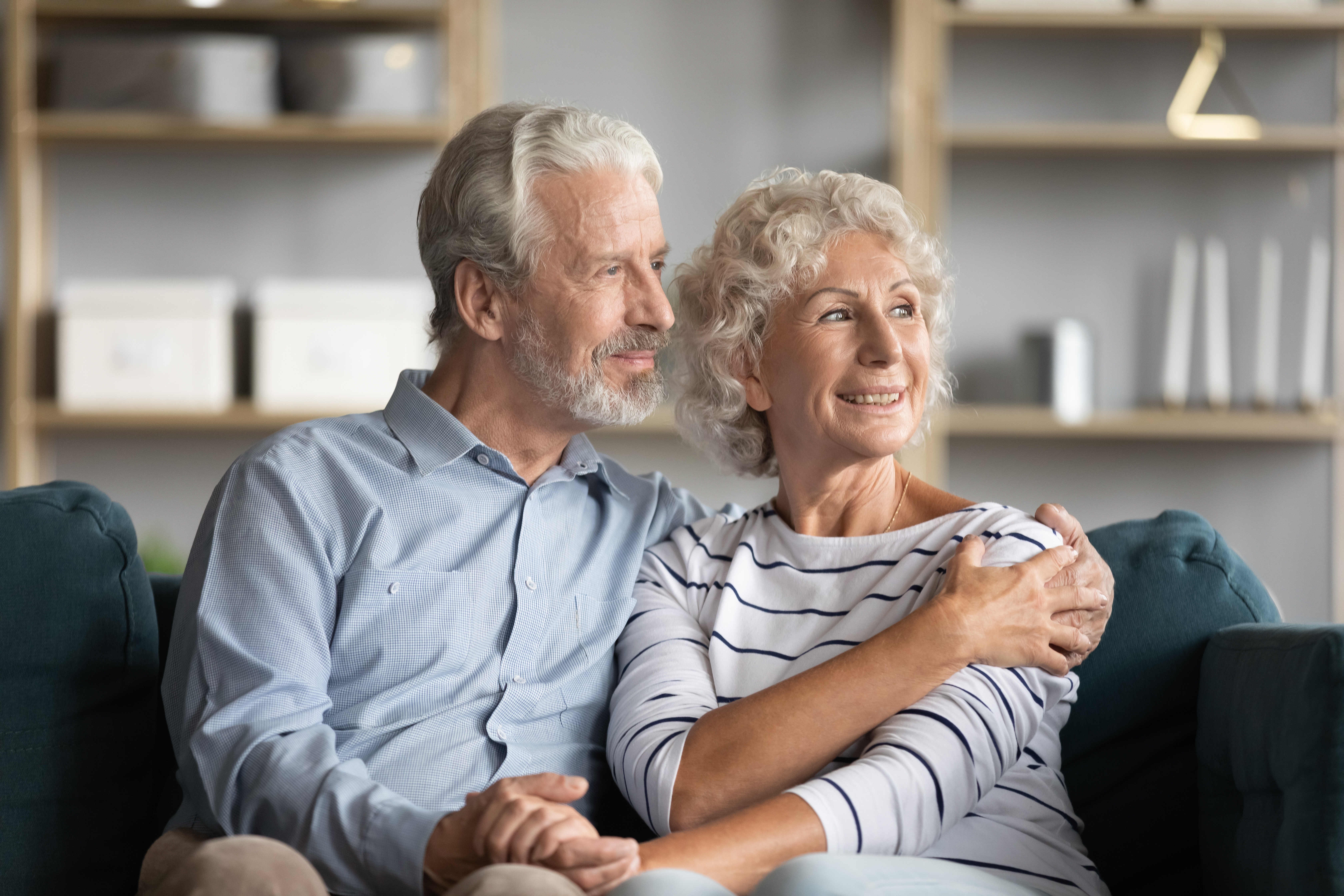 A happy senior couple relaxing at home | Source: Shutterstock