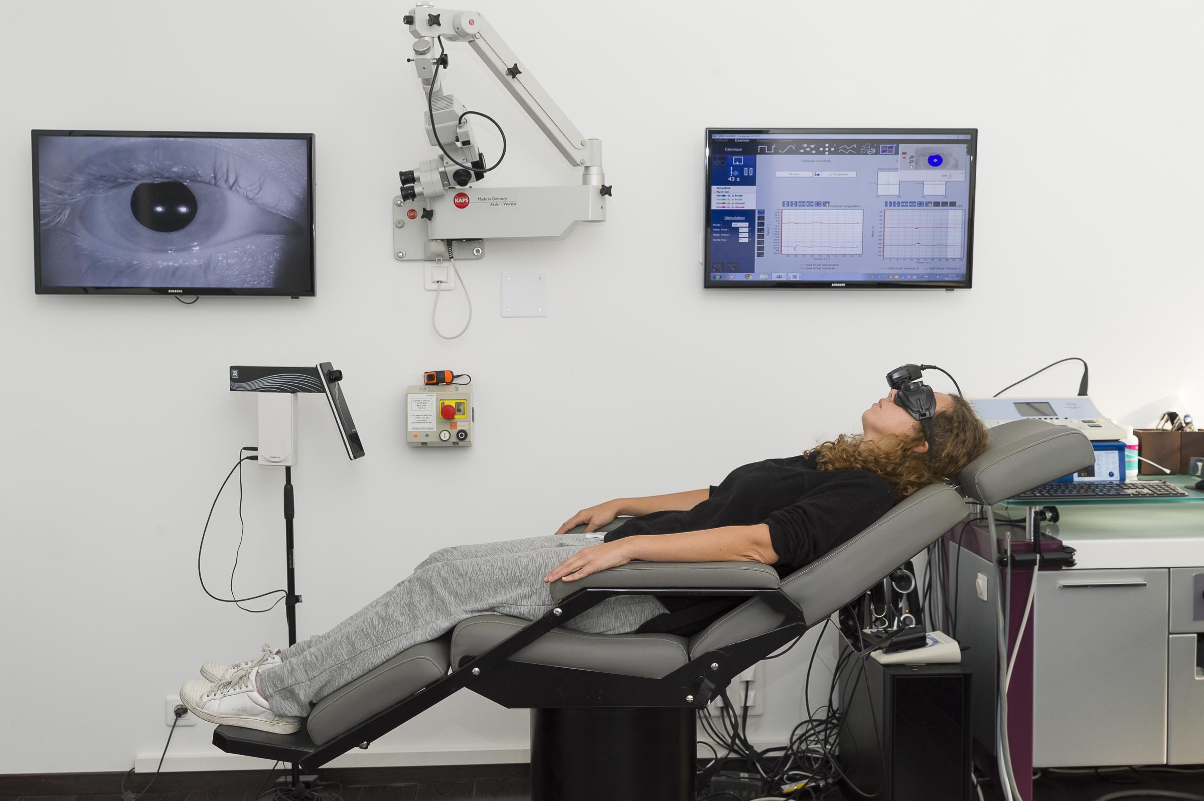 Woman undergoing vestibular function testing during an ENT (ear, nose, and throat) evaluation | Source: Getty Images