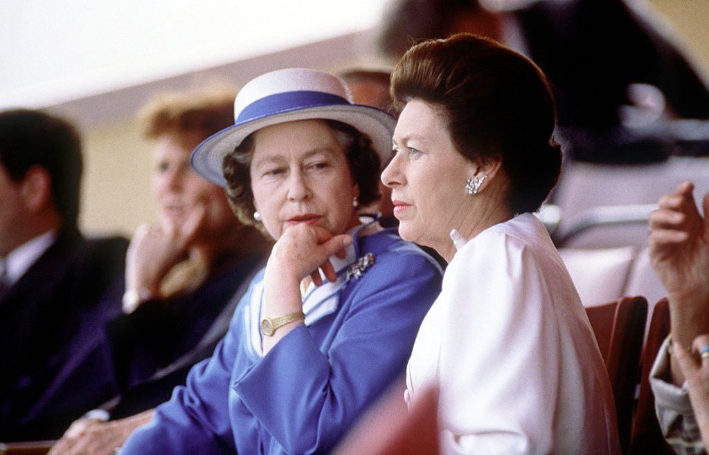  Queen Elizabeth and Princess Margaret during a royal event. | Source: Getty Images