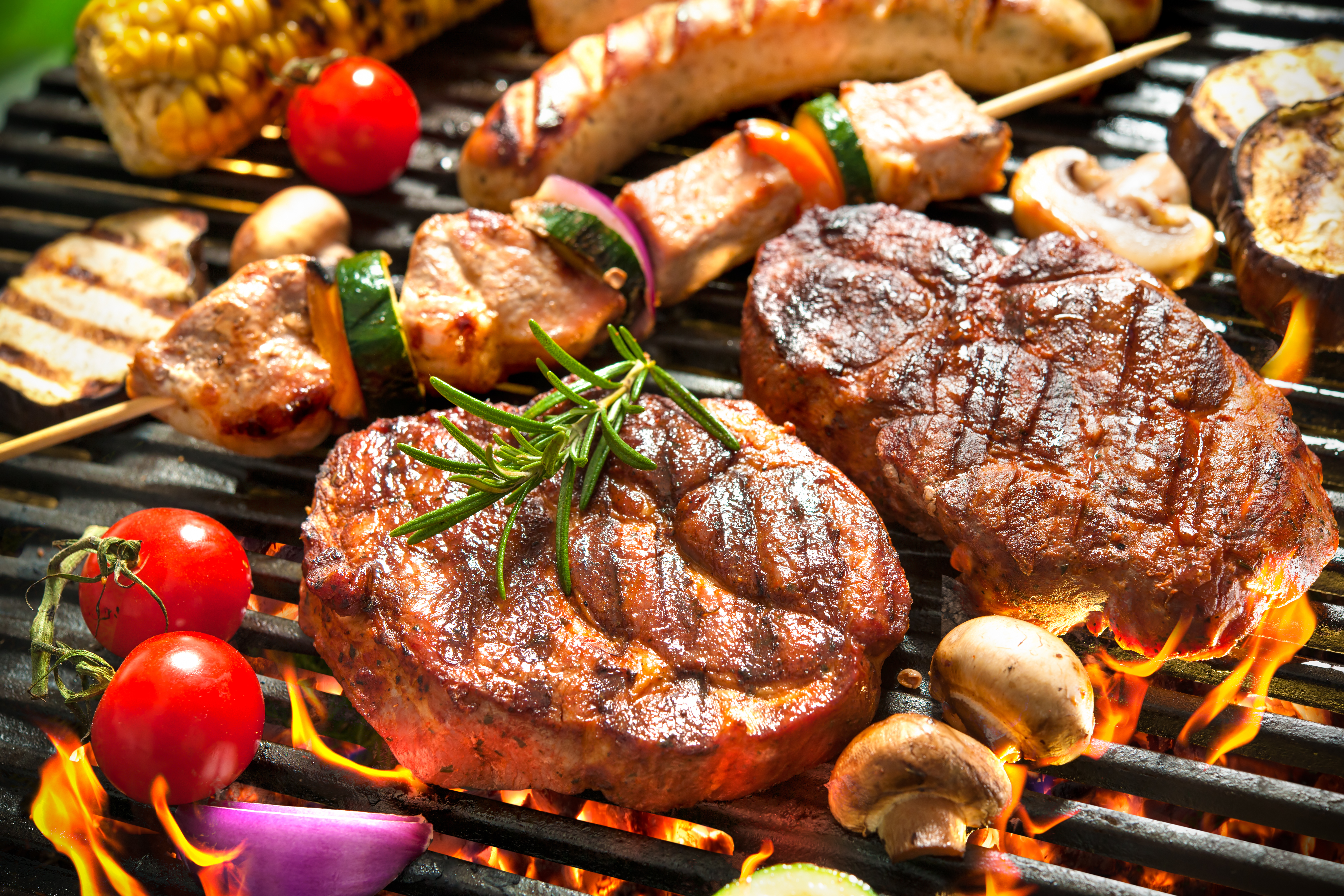 Some barbecue meat cooking on a grill | Source: Shutterstock