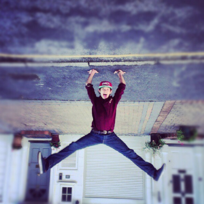 Through dedication and hard work, he constantly refined his acrobatics and dancing skills from an early age. In this photo, he performed a handstand on the street on June 16, 2012. | Source: Getty Images