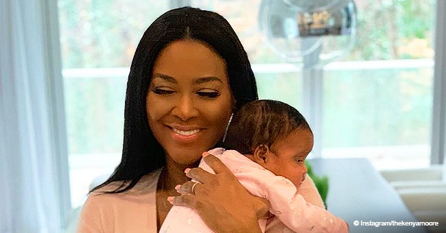 Kenya Moore grabs tons of attention, poses bare-skinned in bed with her husband & smiling daughter