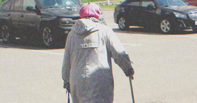 An old lady walking in a parking lot | Source: Shutterstock
