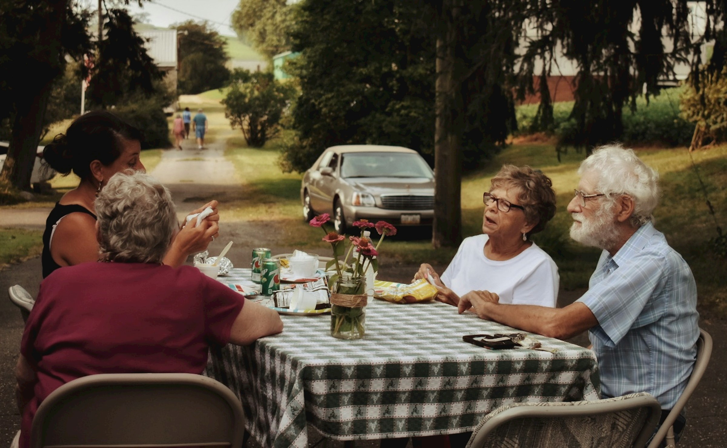 A family gathered for dinner outdoors | Source: Unsplash